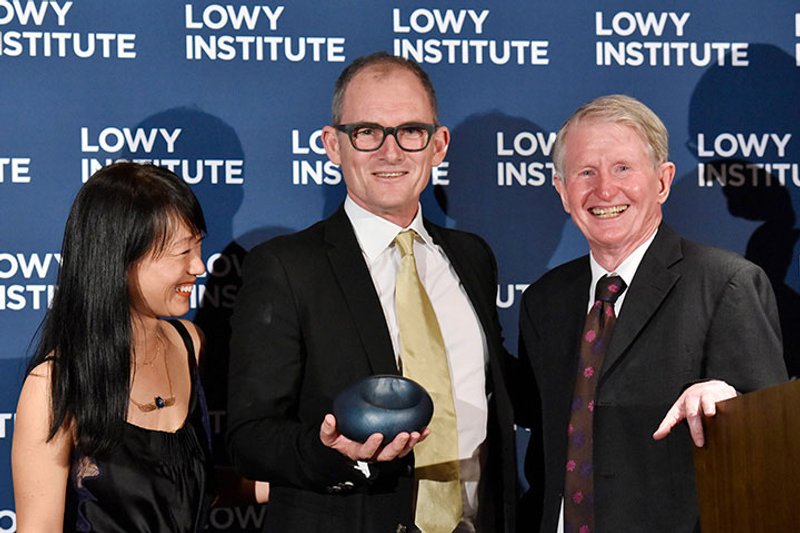 Evan Williams and Bernadine Lim receiving the 2018 Lowy Institute Media Award from veteran ABC correspondent Sean Dorney.