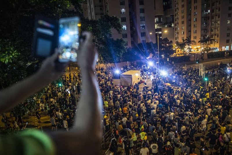 Recording demonstrators in Wong Tai Sin district, Hong Kong