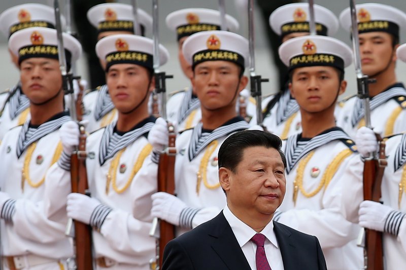 President Xi Jinping with a guard of honour formed by Chinese People's Liberation Army navy soldiers during a welcoming ceremony for King Hamad Bin Isa Al Khalifa of Bahrain outside the Great Hall of People on 16 September 2013 in Beijing, China