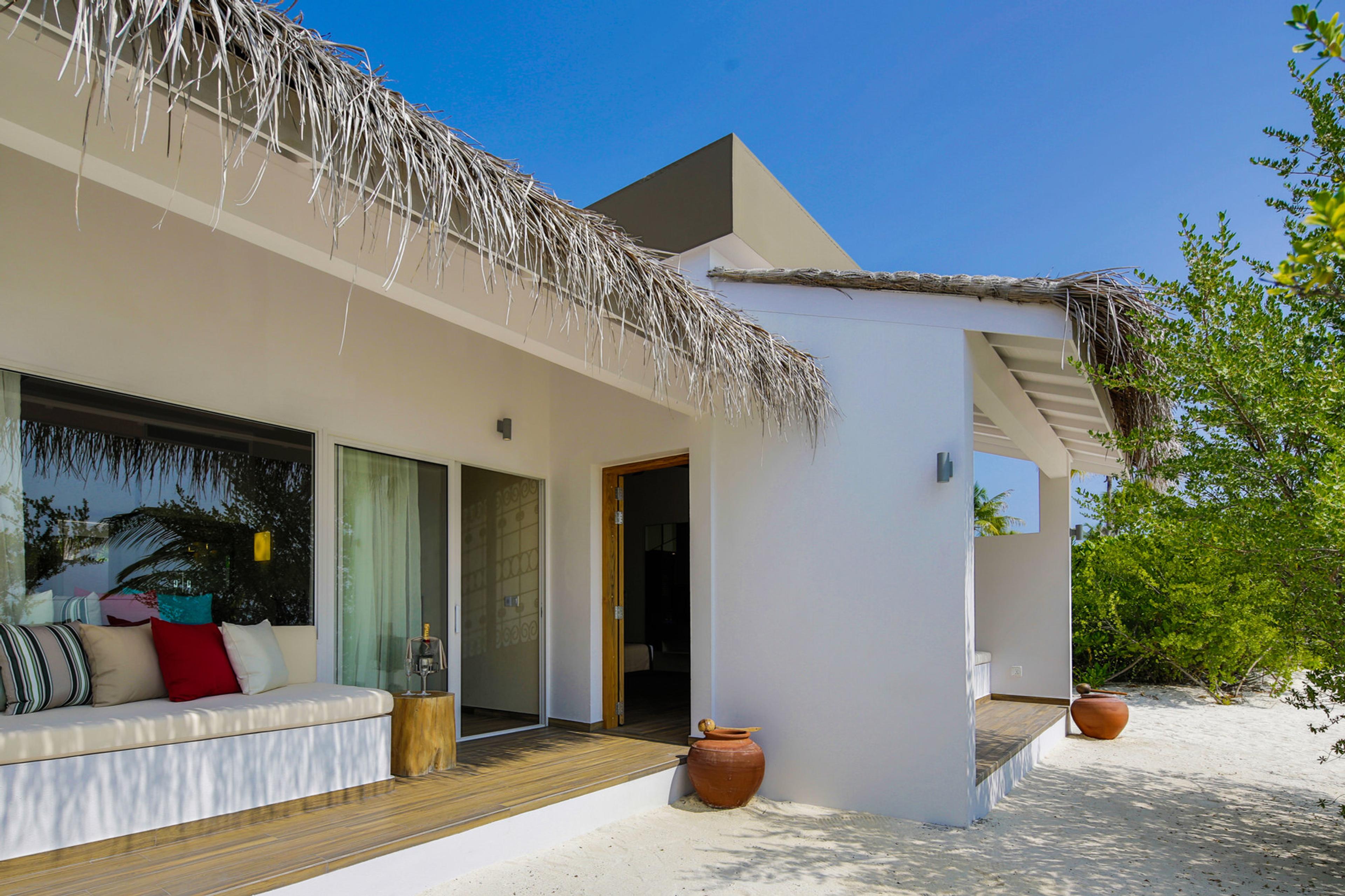 Family beach villa opening onto the sand