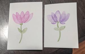 two cards with a watercolor flower on each