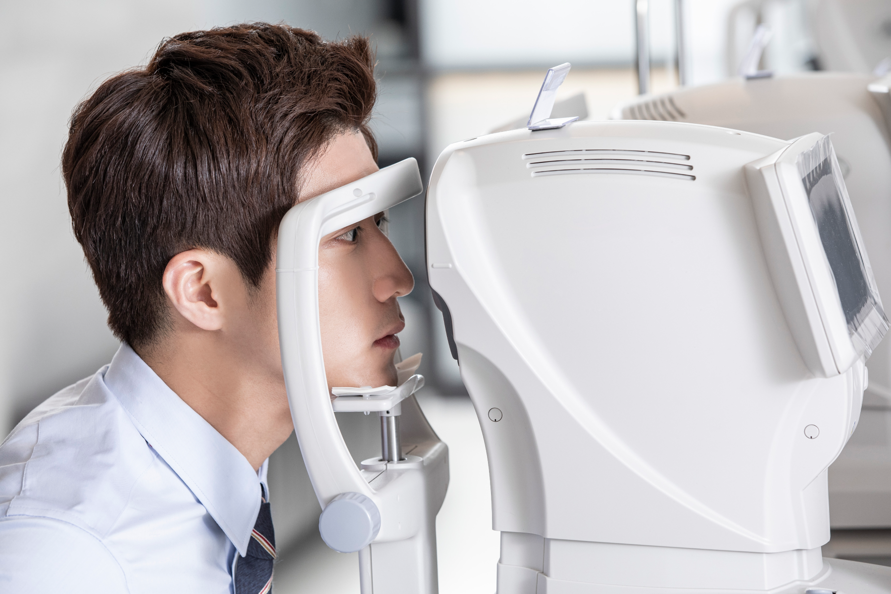 An ophthalmologist reviewing corneal measurements during a pre-operative assessment.
