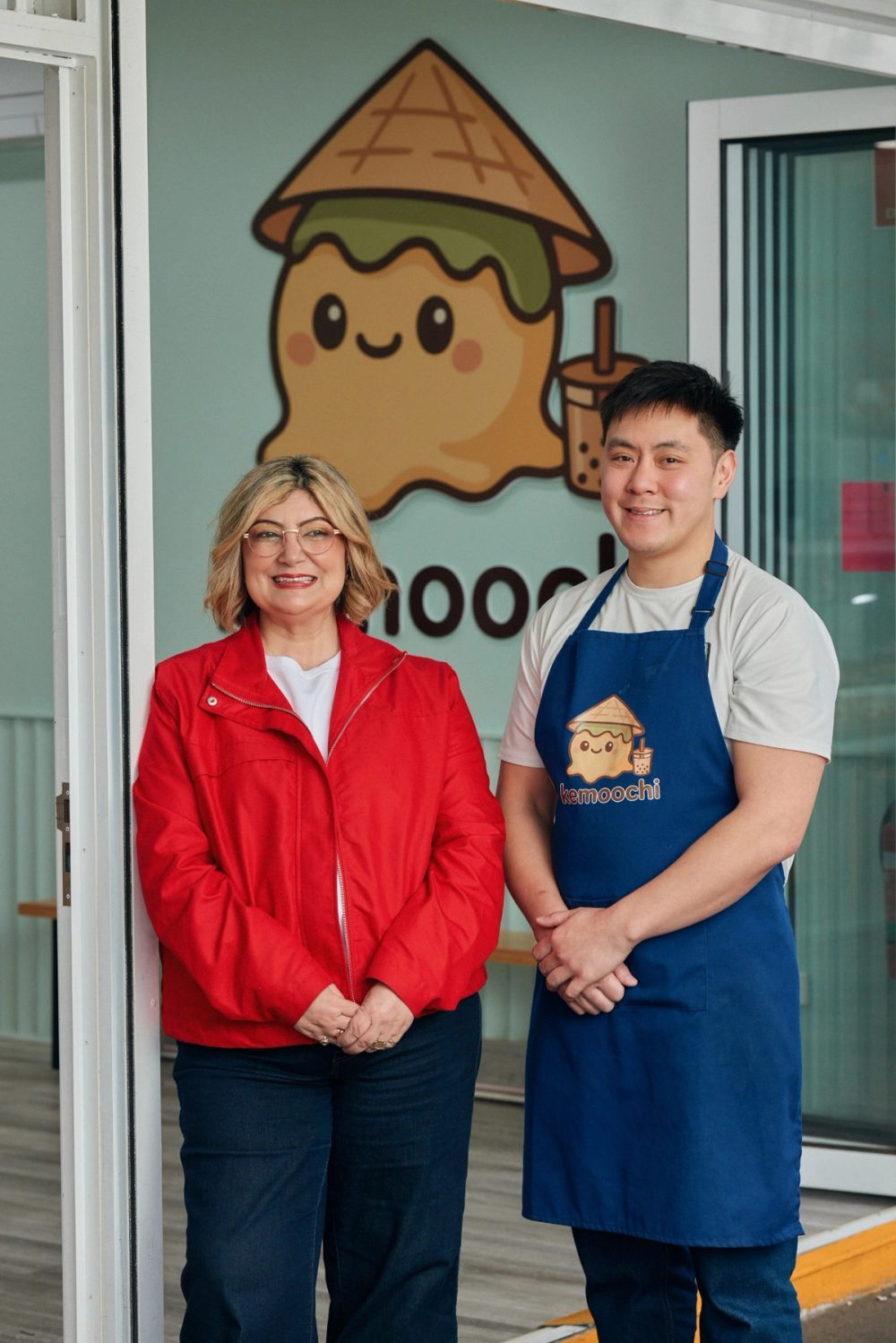 Natalie with a local business owner outside Kemoochi
