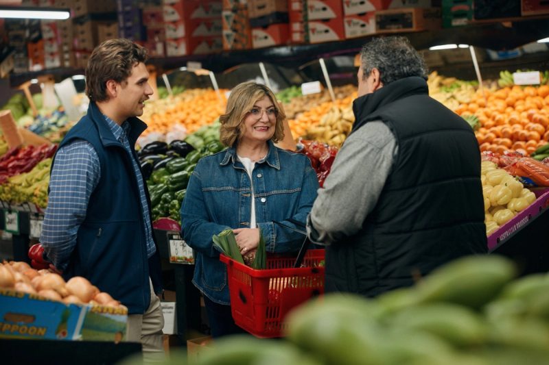 Natalie chatting with traders at a local fresh food market