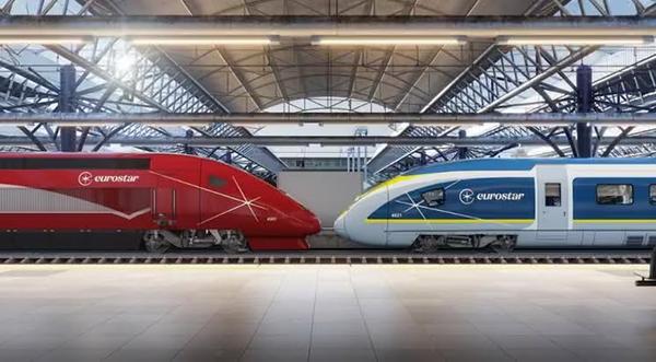 Deux trains Eurostar, l'ancien rouge (ex-Thalys) et le bleu, face à face sous la verrière d'une gare, sur la ligne Bruxelles-Amsterdam © NL Times