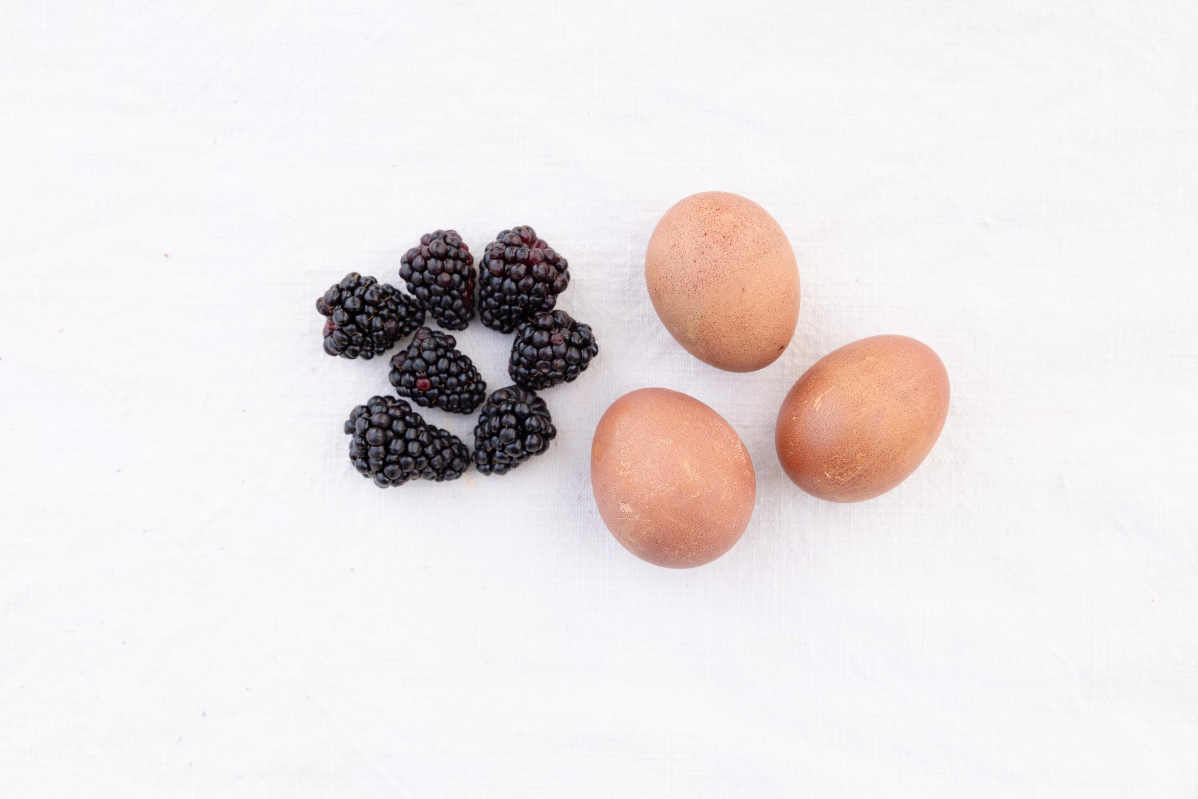 Blackberries next to eggs