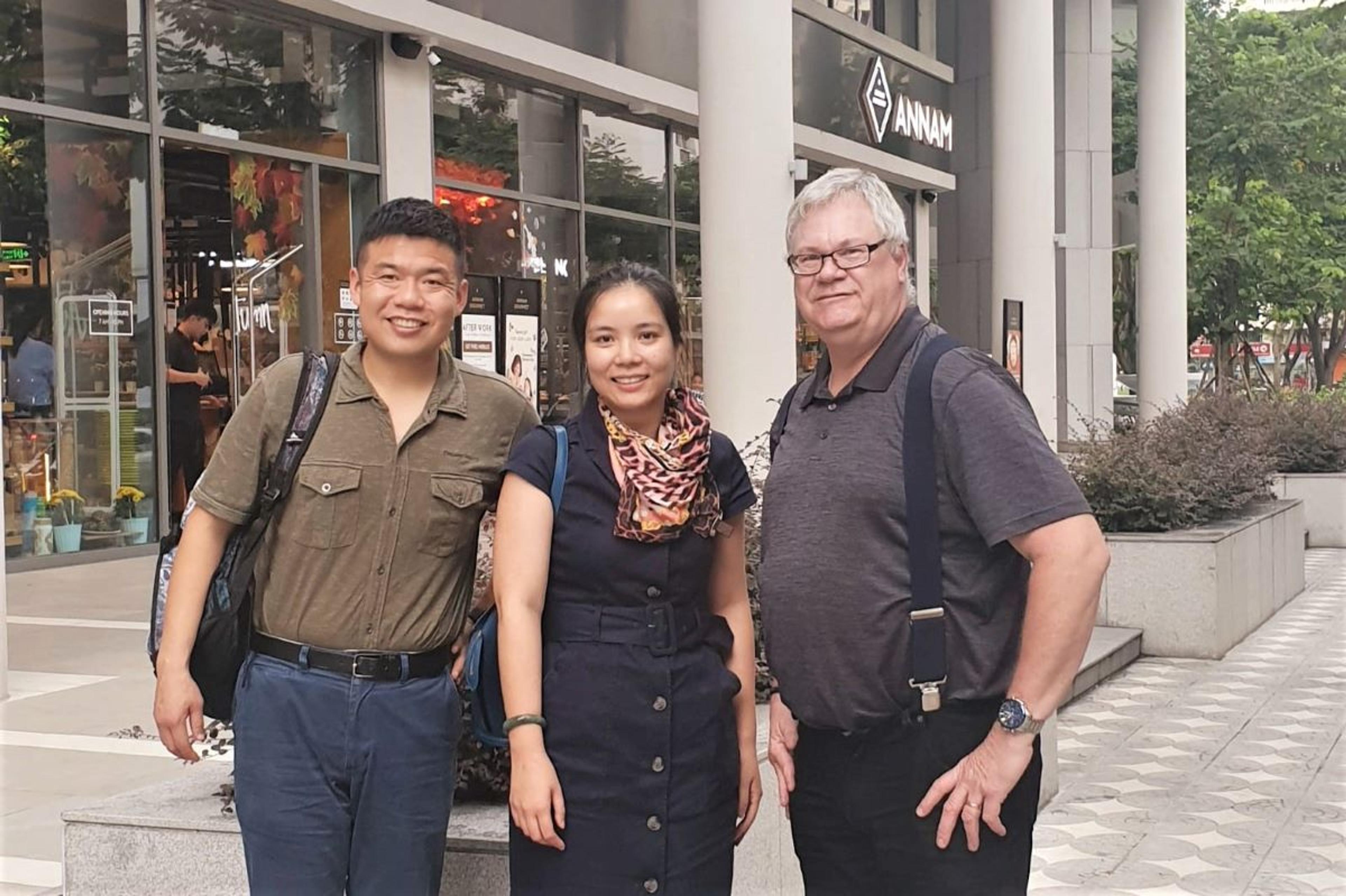 Han Ha, Quyen Phan, and Organic Valley Director of International Sales Craig Deadman.
