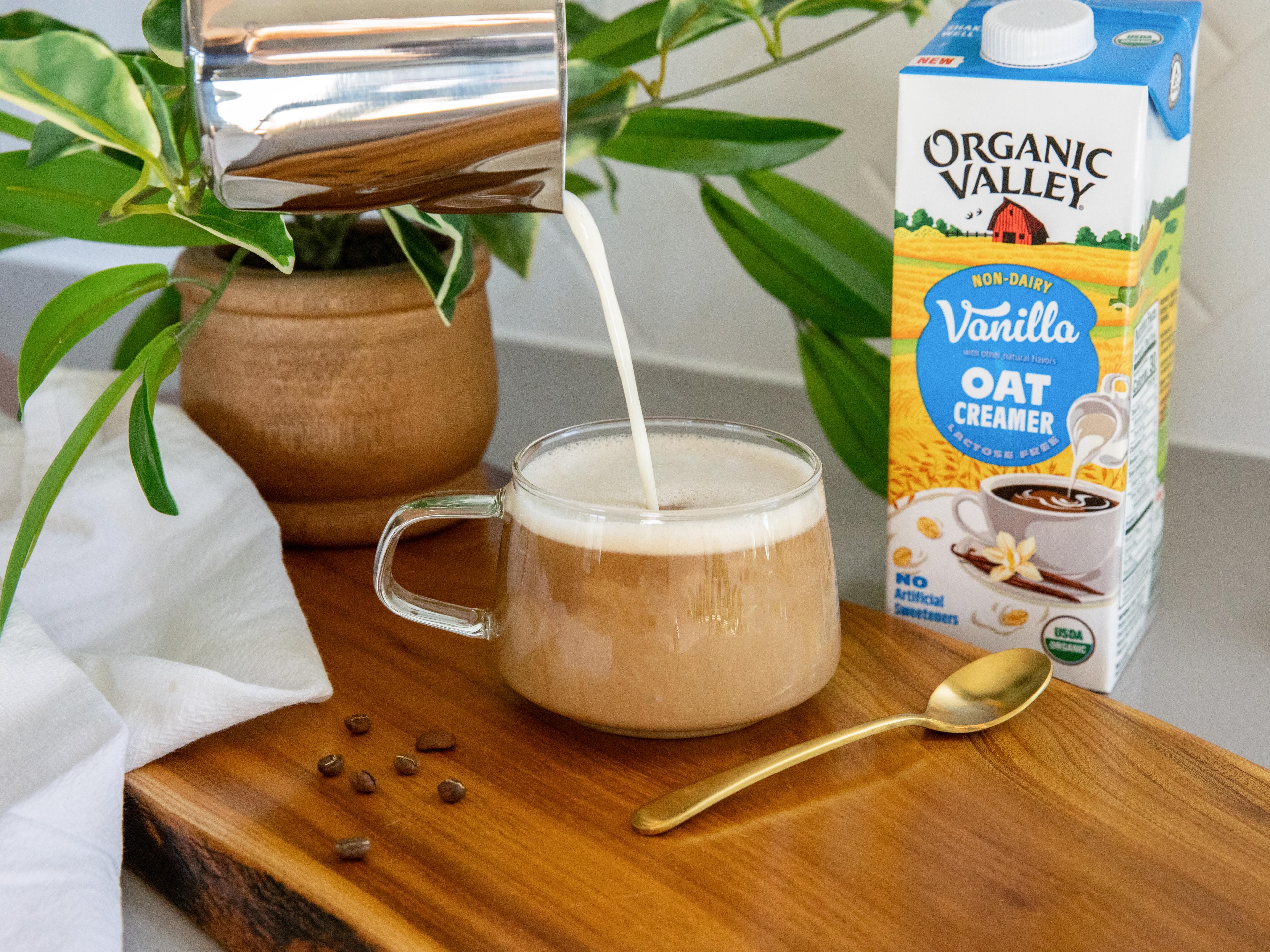 Frothed Organic Valley® Vanilla Oat Creamer poured into cup of espresso.