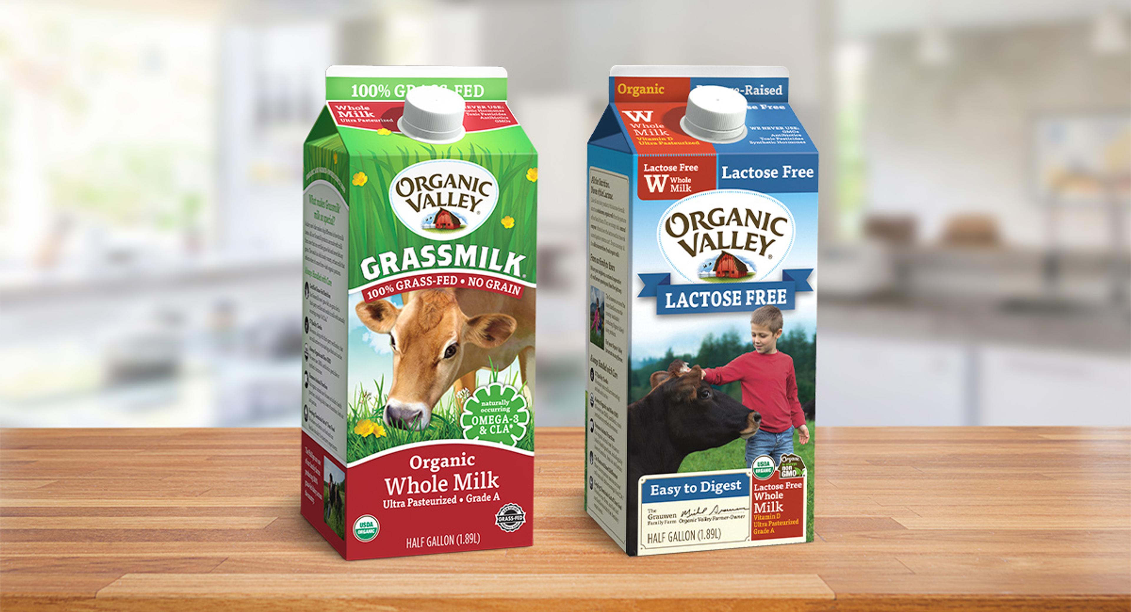 Organic Valley Grassmilk and Whole Lactose-Free Milk displayed on a table.