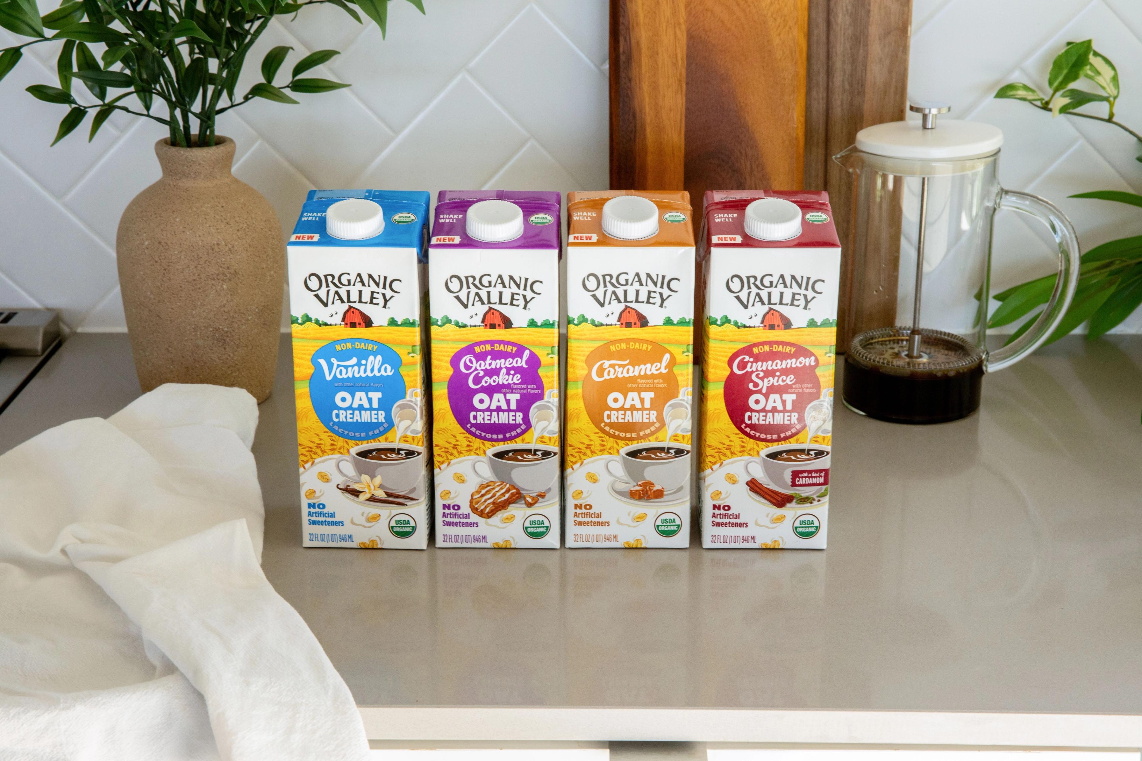 The four flavors of Organic Valley® Oat Creamers on a kitchen counter.    