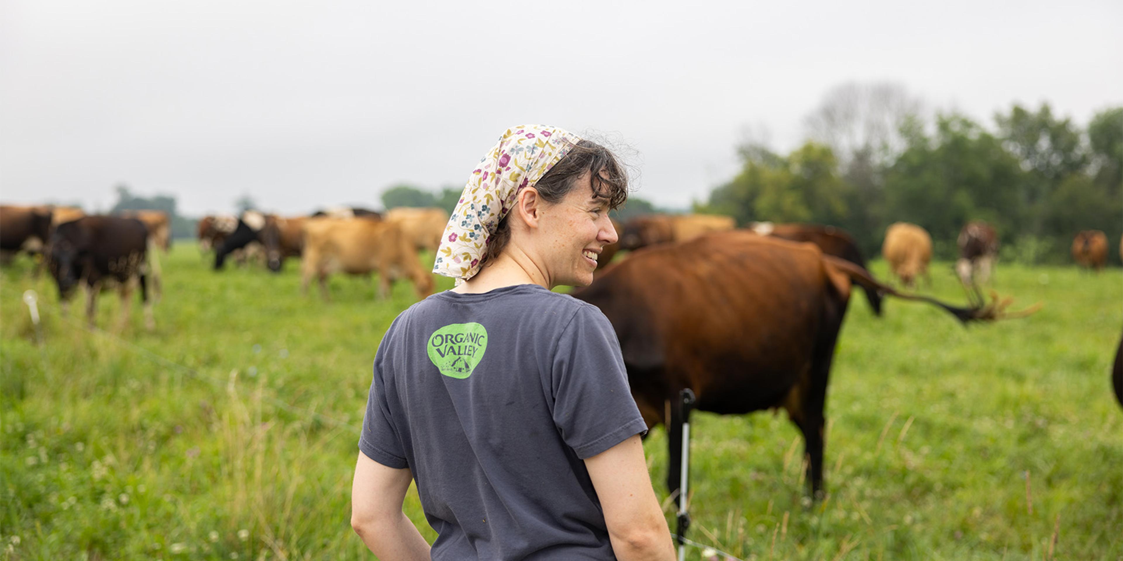 Ashley Canter checks on cows at her organic farm.