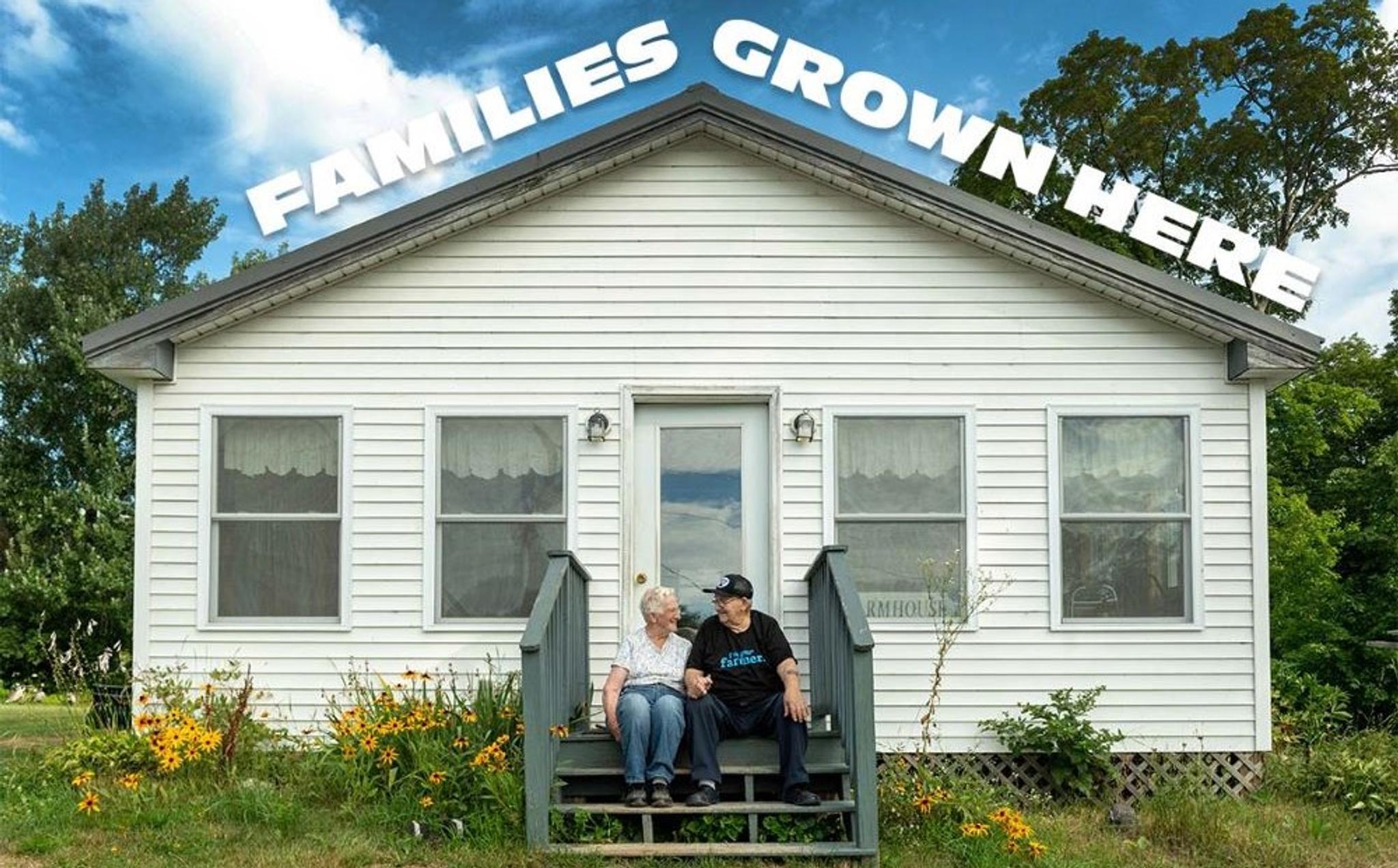 The Turners sit on the steps of their home in Maine.