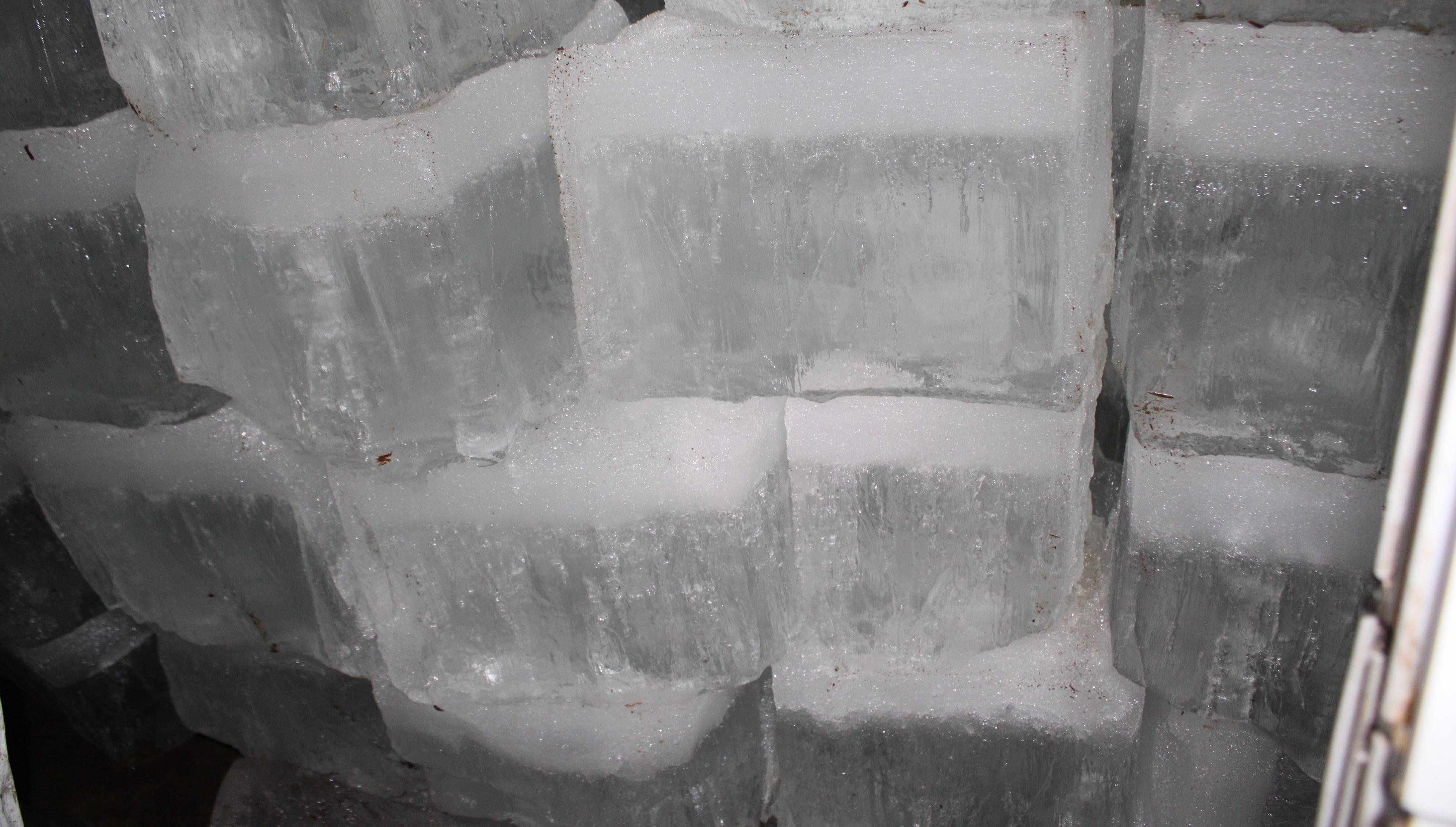 Large chunks of ice stacked in the Amish ice house on the Lambright farm.