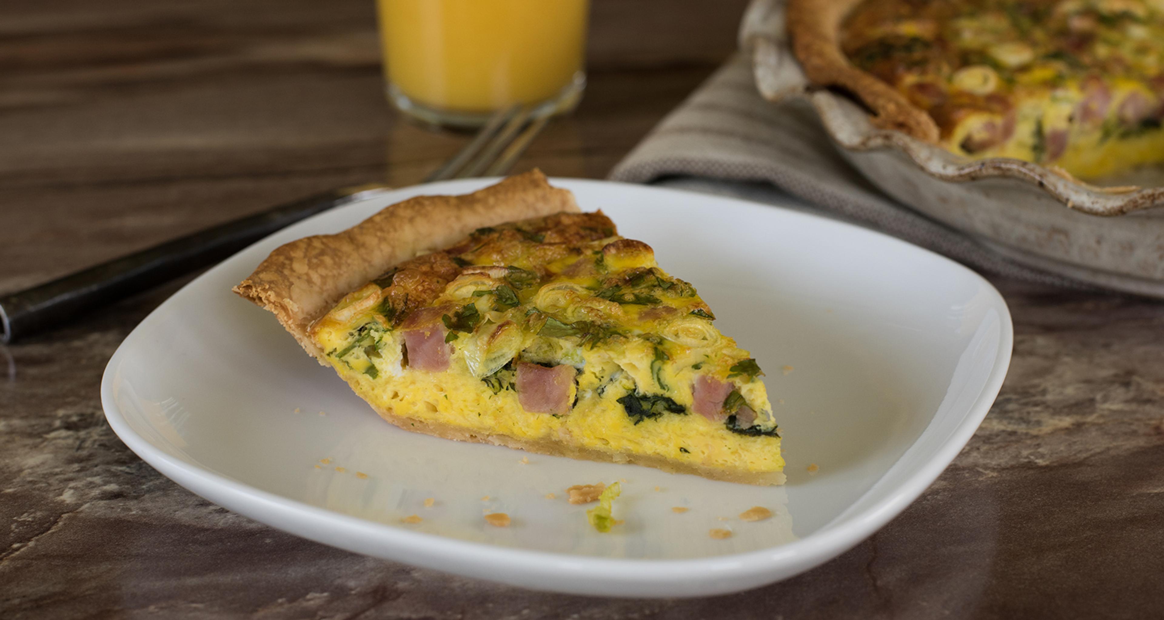 This Breakfast Delight Quiche combines classic flavors in an easy pie crust.