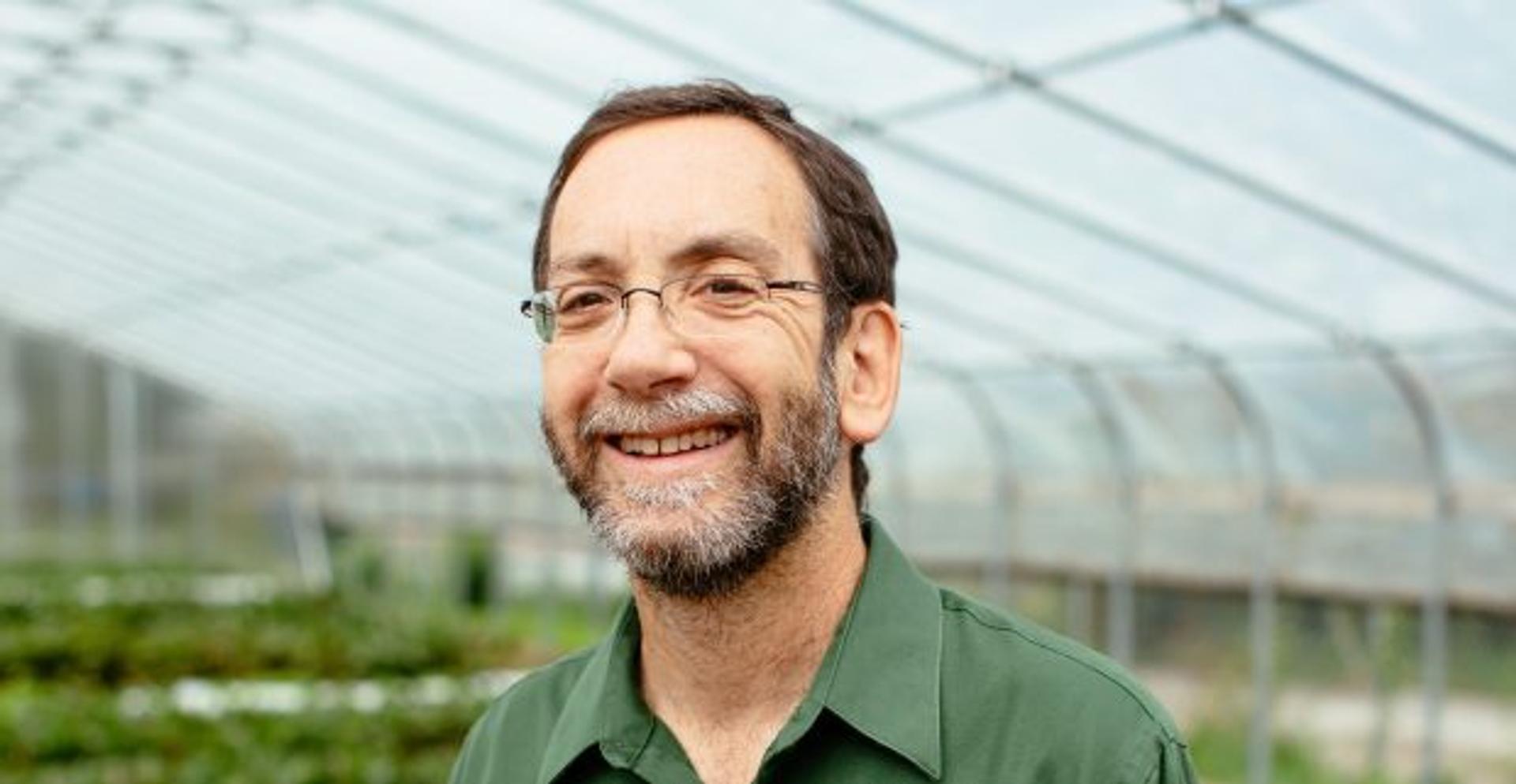 Harry Rhodes in a greehouse. 