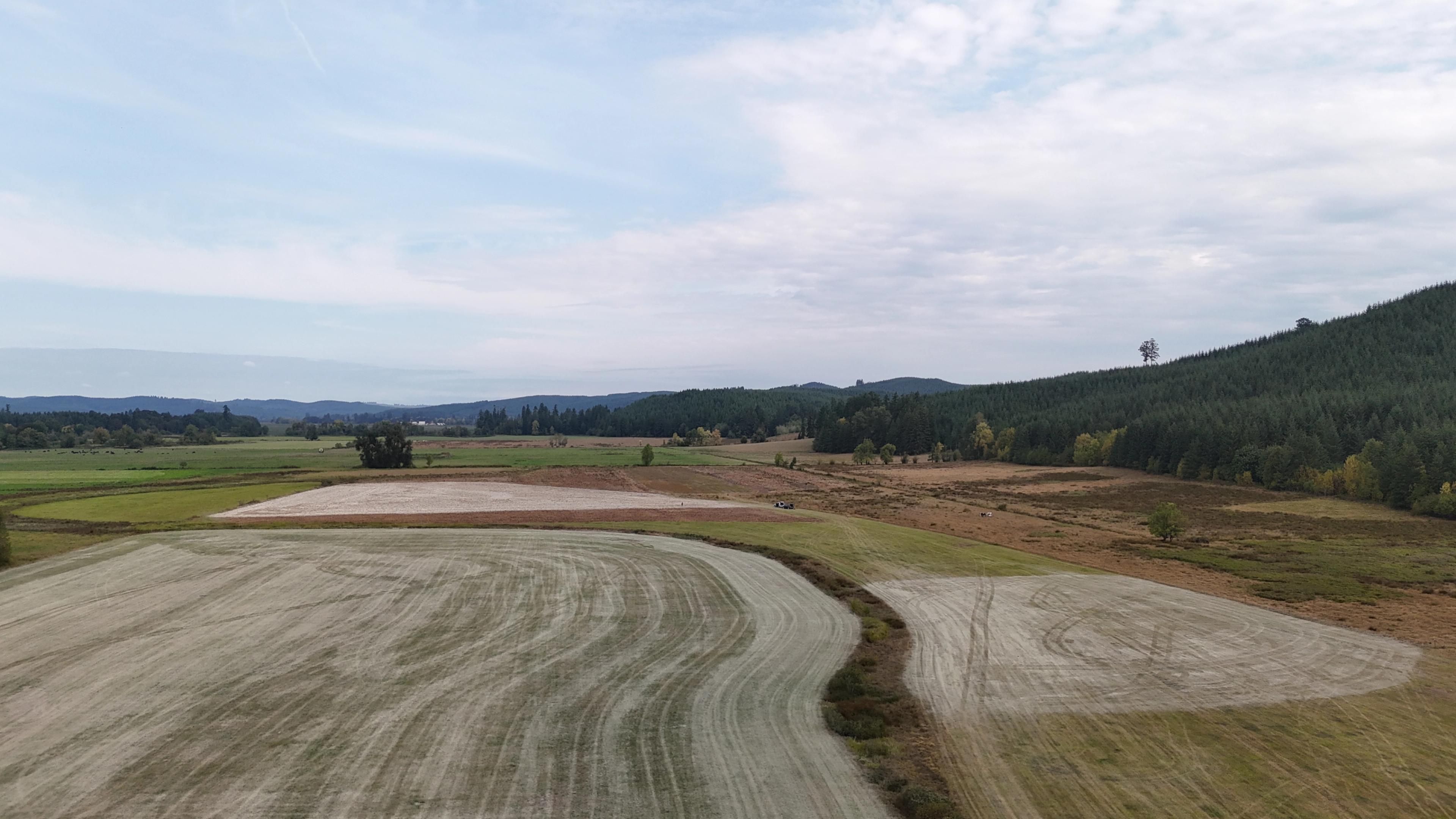 An aerial view of fields after a light rock dusting.