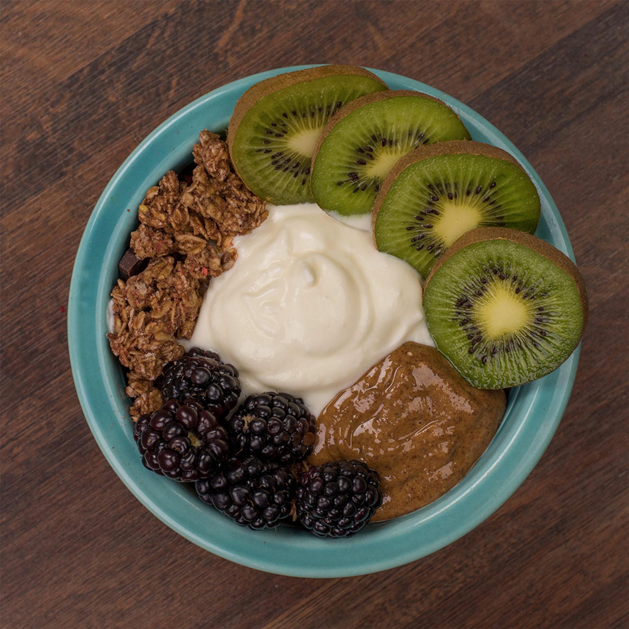 Yogurt bowl with fruit, almond butter and granola.