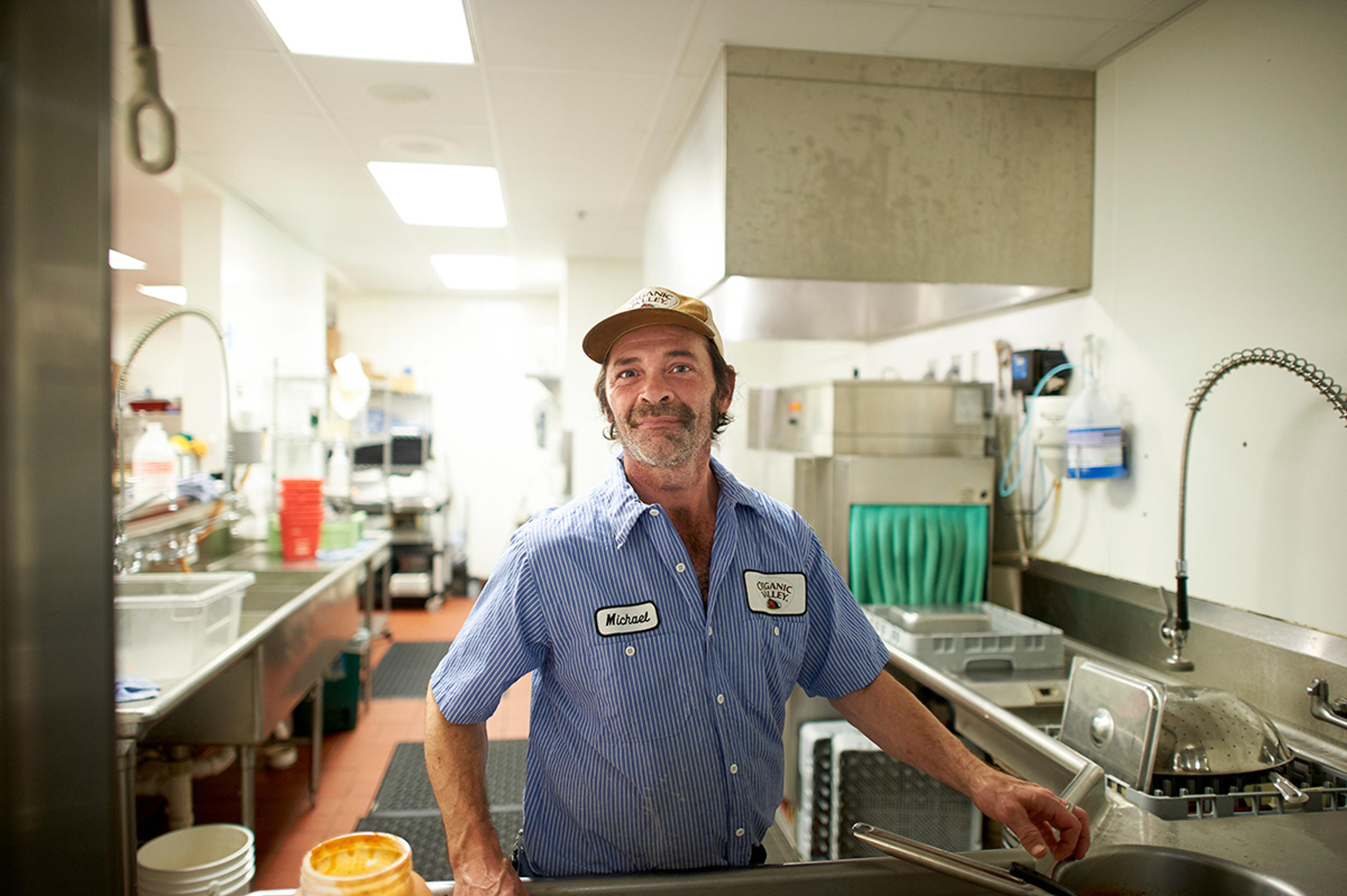 Organic Valley employee strikes a pose next to the cleaning facilities in the office building in La Farge, Wisconsin.