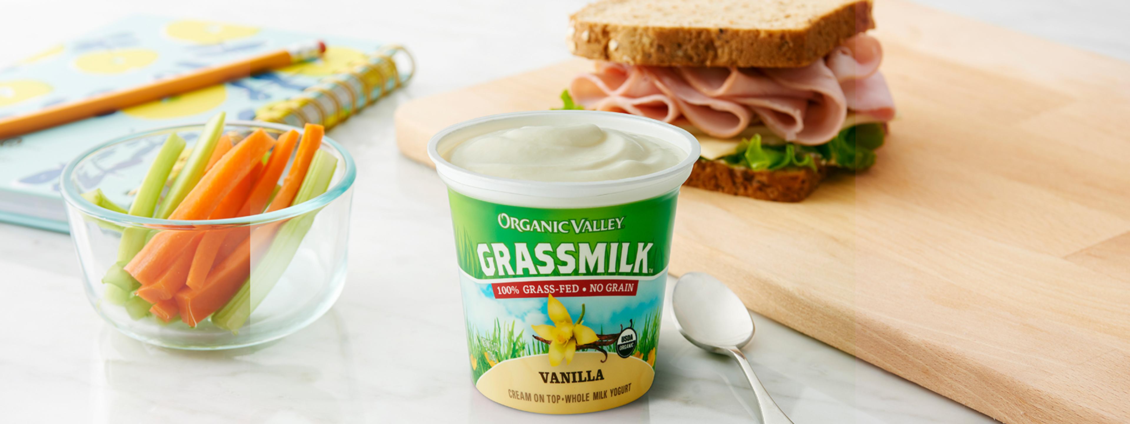Organic Valley yogurt next to a deli meat sandwich