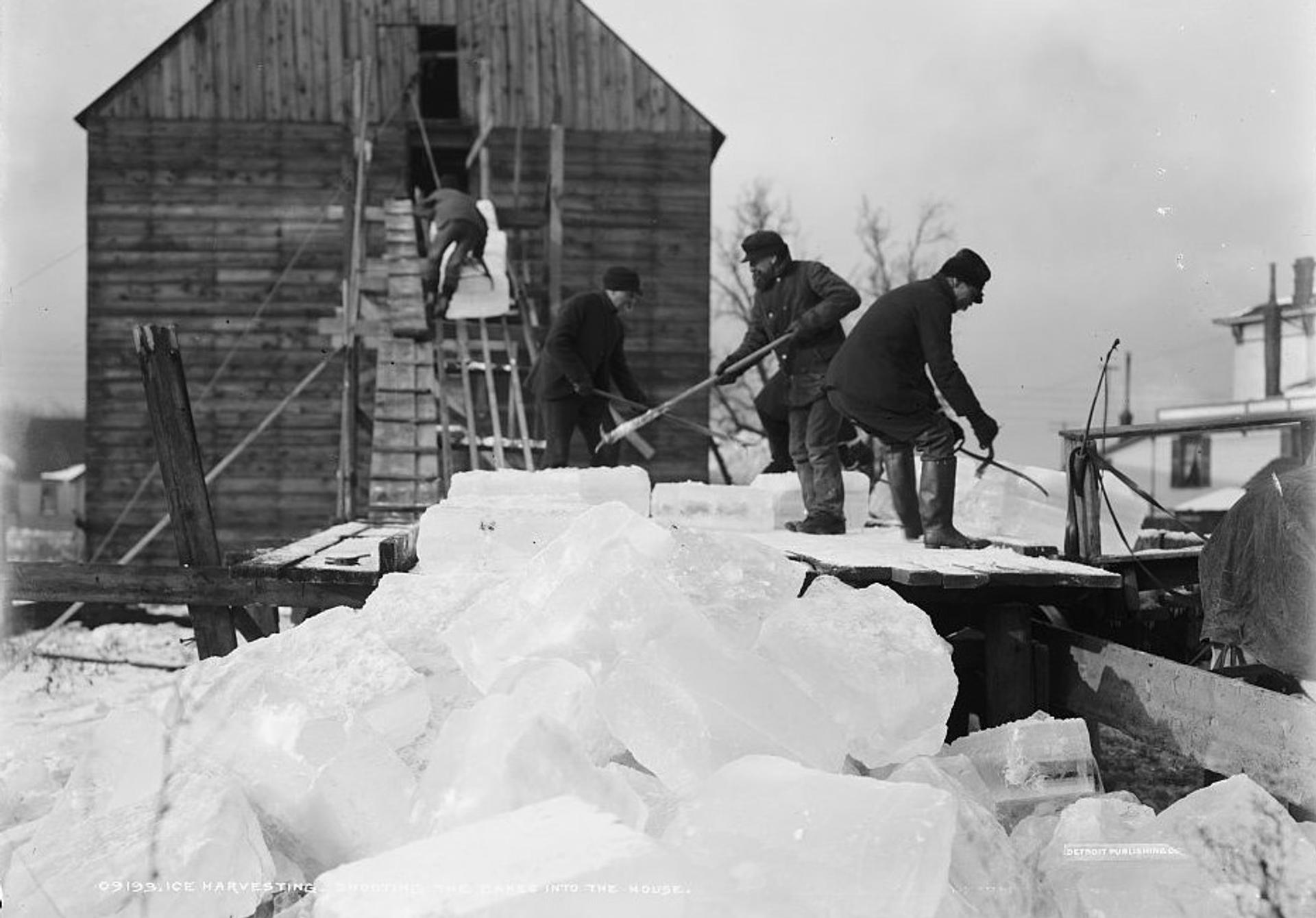Men store ice in an ice house in a circa 1903 photo from the Library of Congress collection.