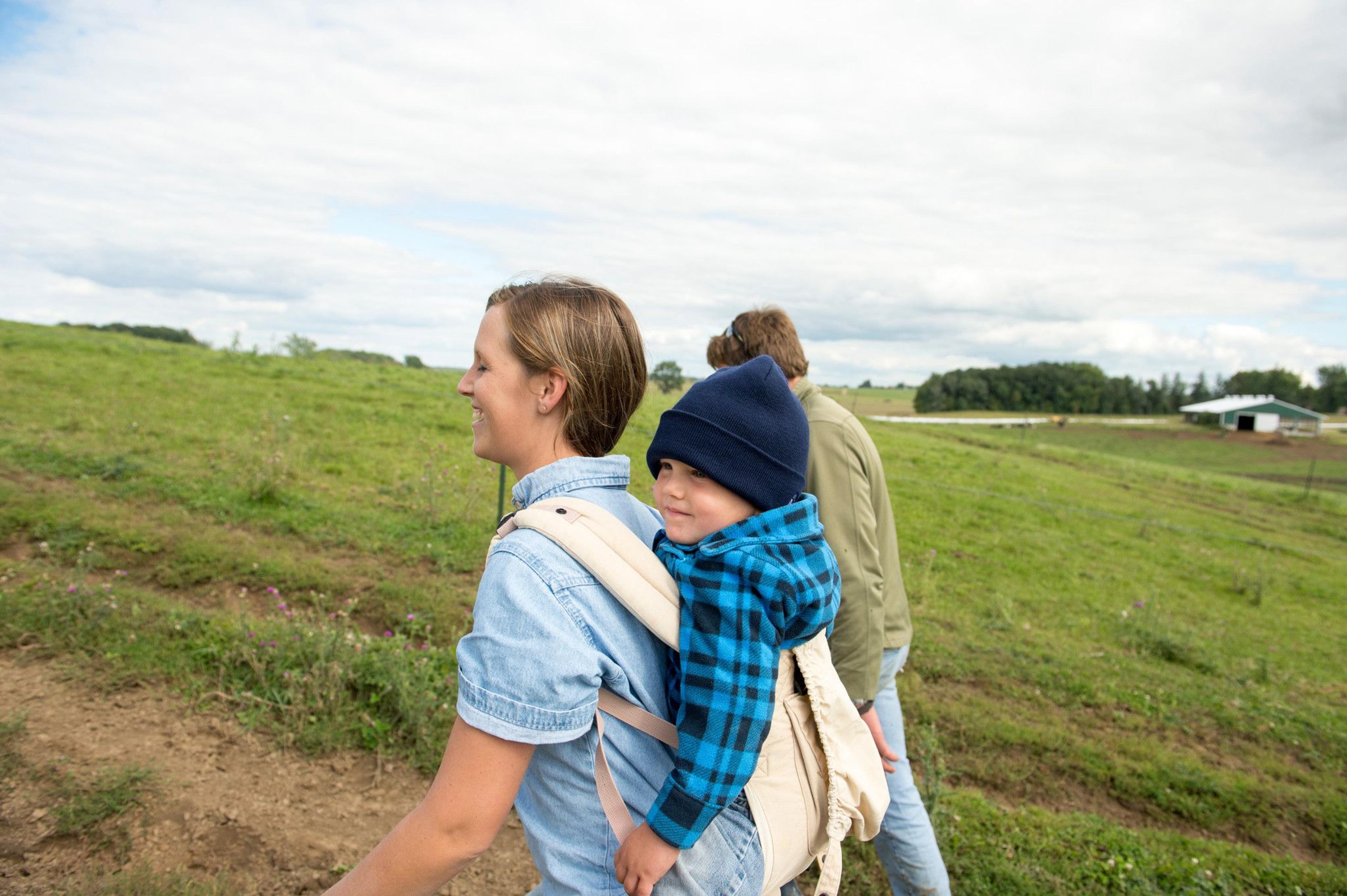 The O’Reilly family, Minnesota, walks in a field.