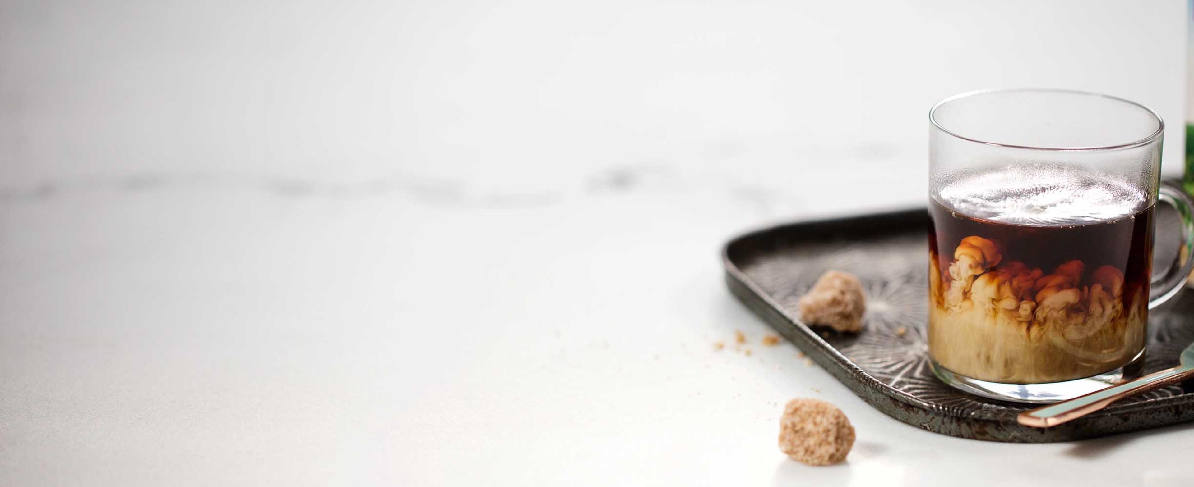 Coffee with creamer in it.