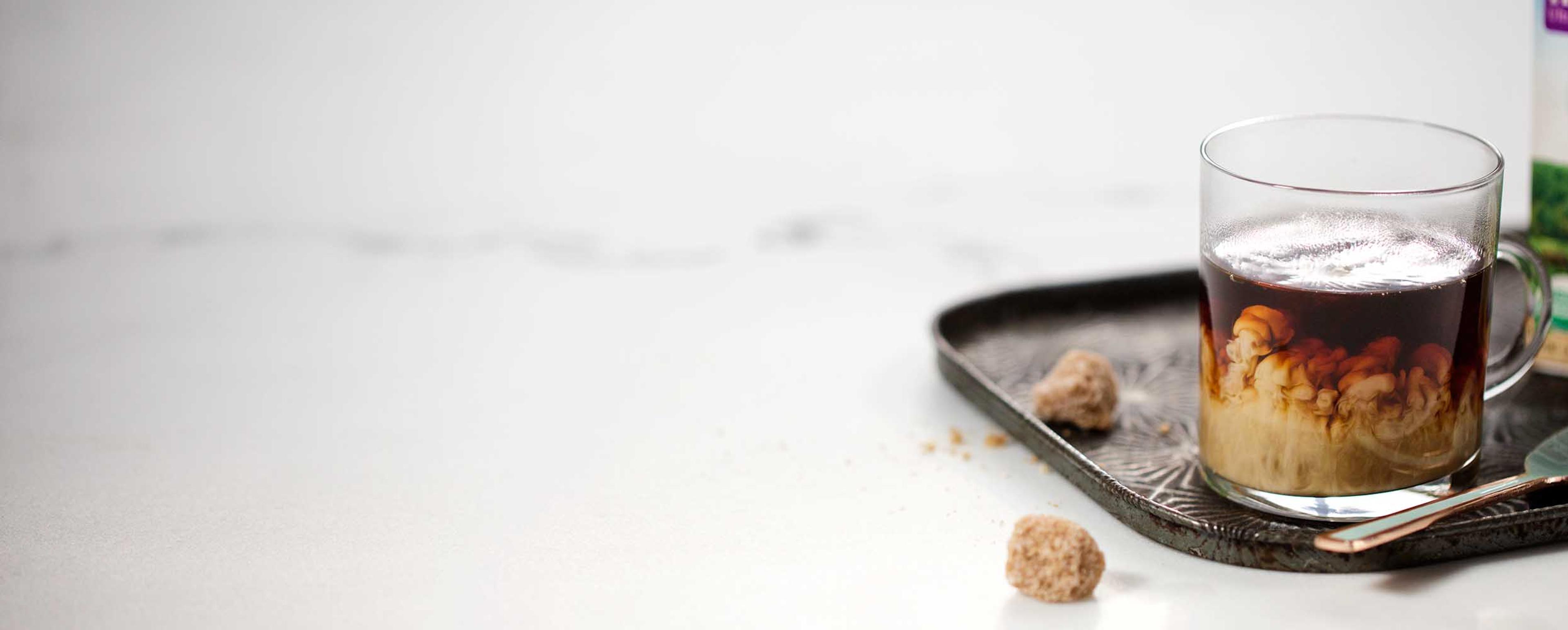 Coffee with creamer in it.