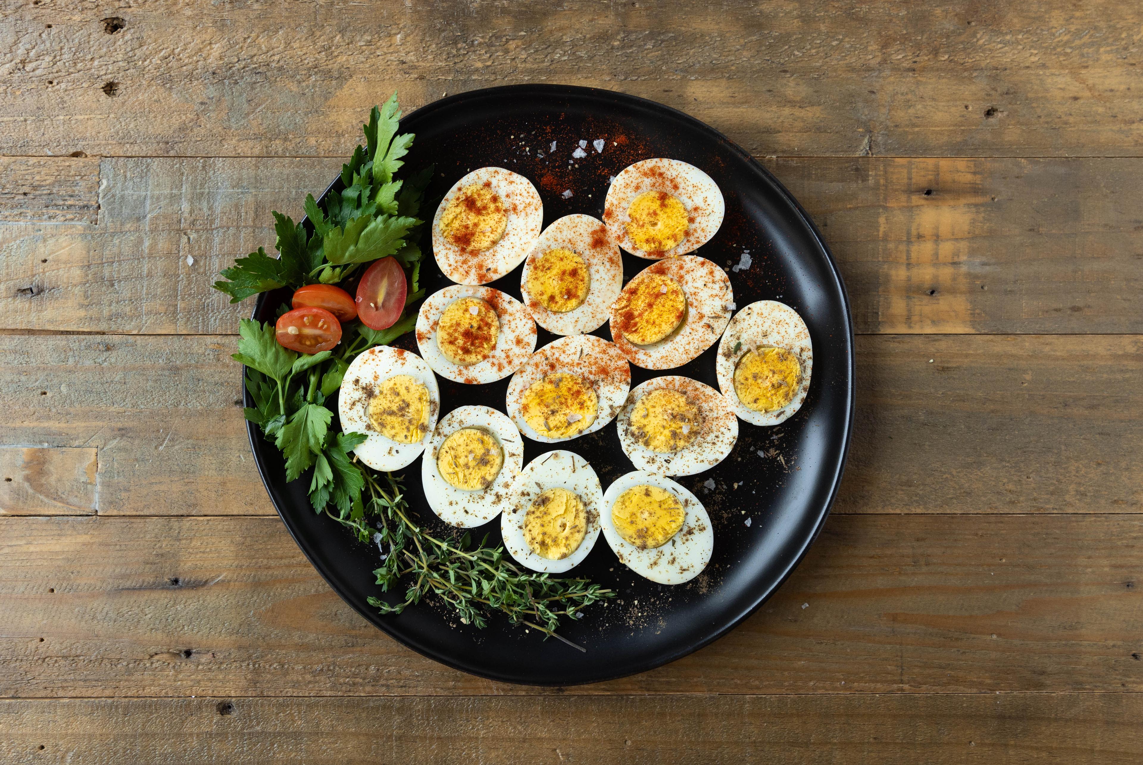 Paprika and jerk seasoning on hard boiled eggs.