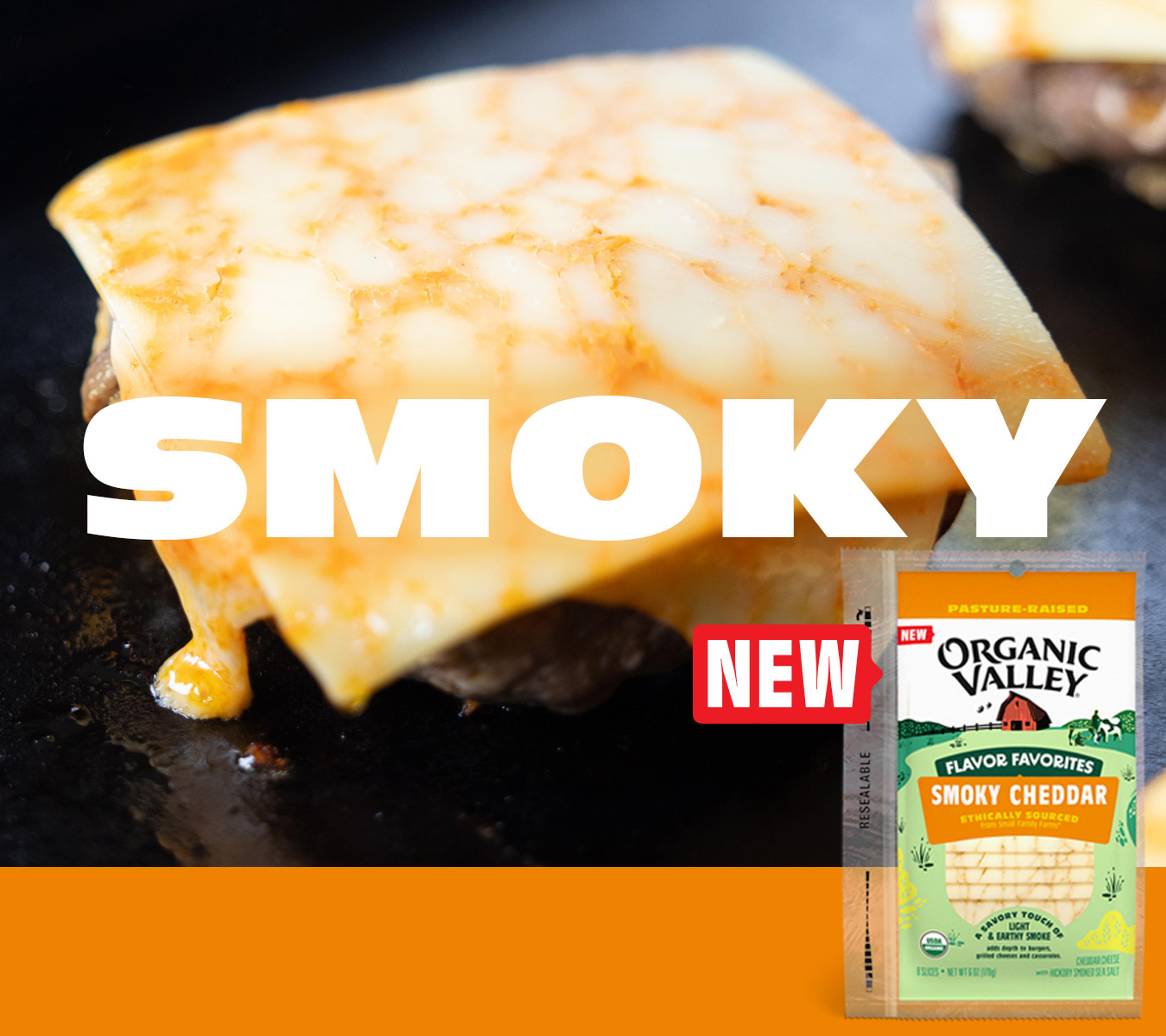 Organic Valley Smoky Cheddar cheese on top of a burger on the grill.