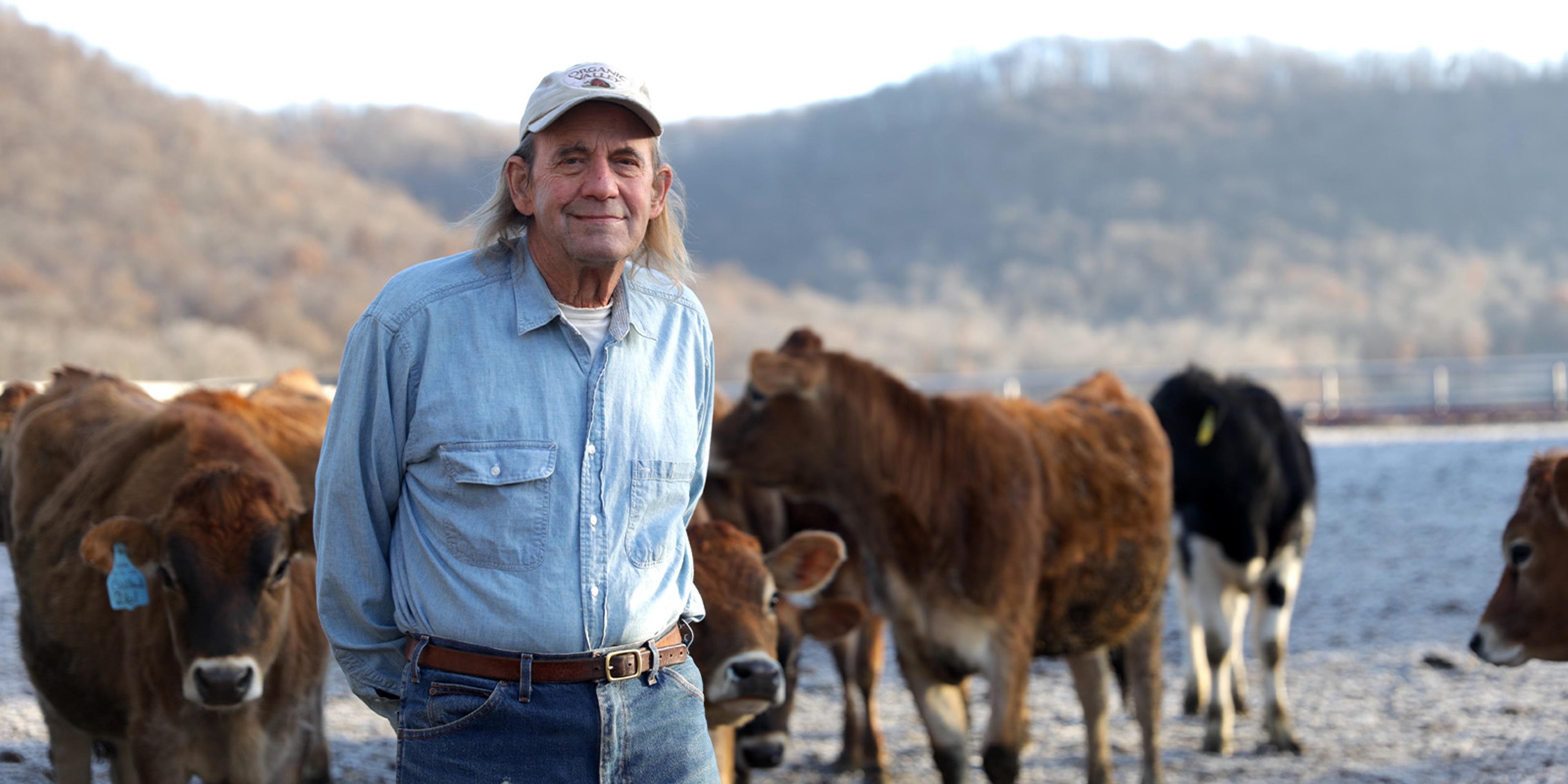 George Siemon stands with cows on his and Jane Siemon’s farm in Wisconsin.