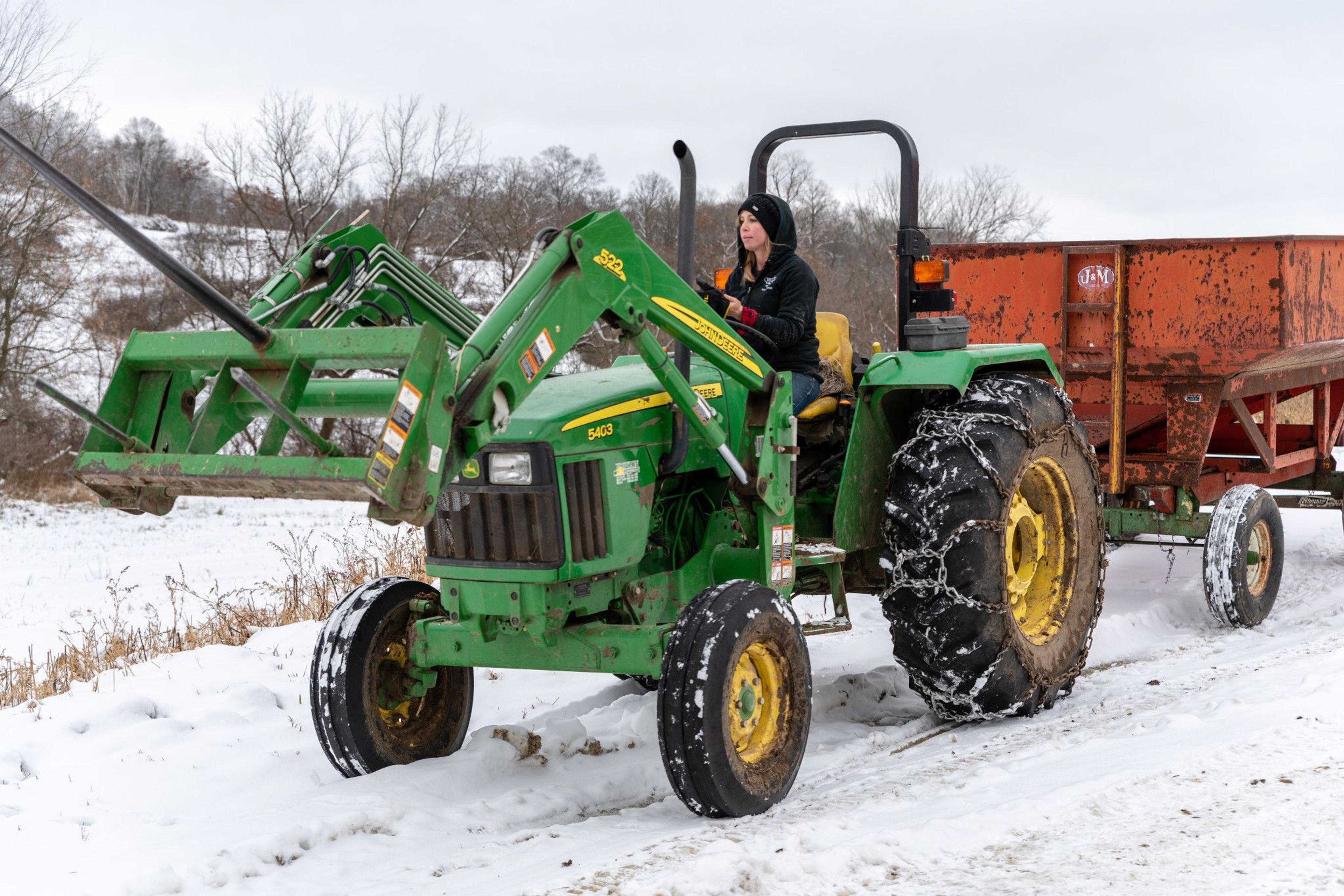 Kristina Ralph drives a tractor.