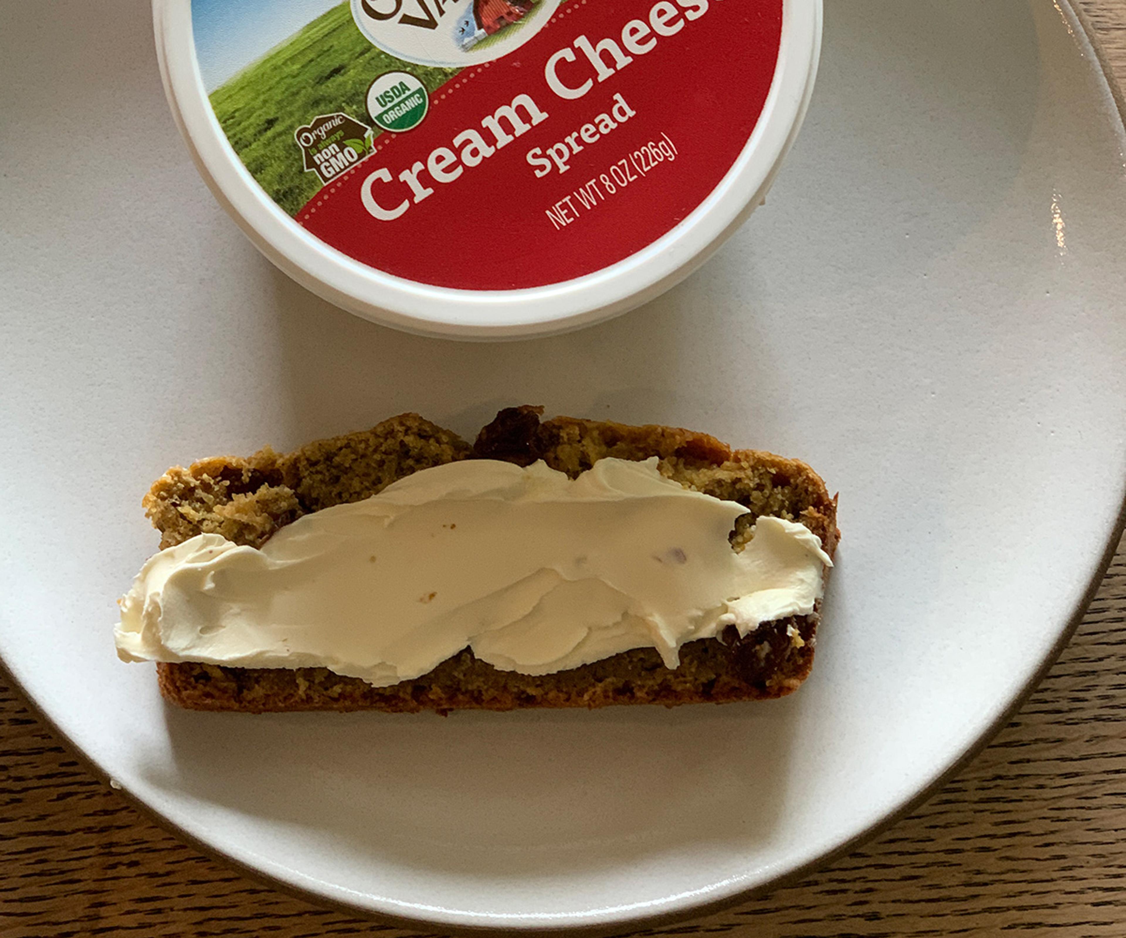 Organic Valley cream cheese spread on a slice of bread. 