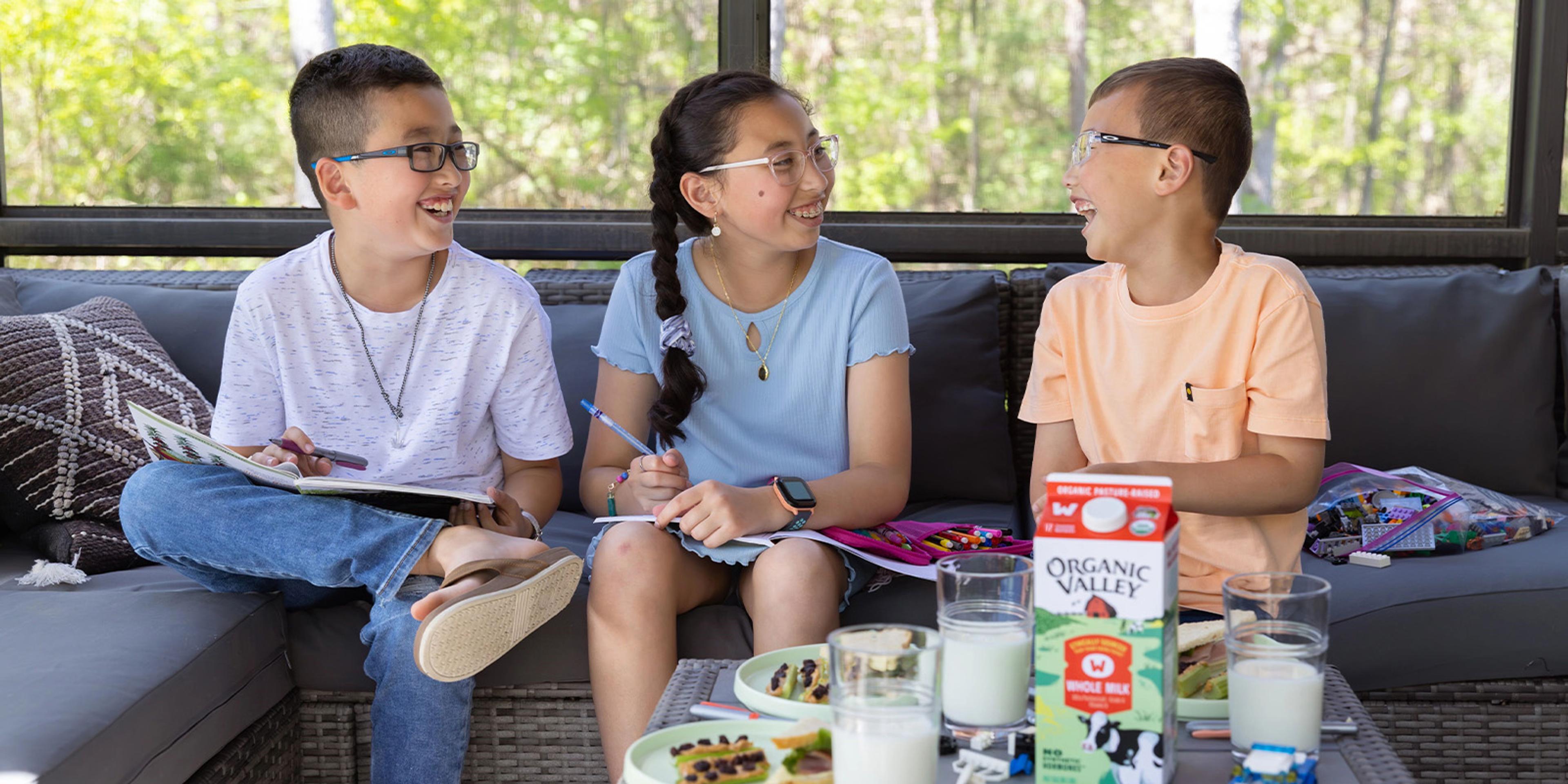 Kids talking while drinking milk