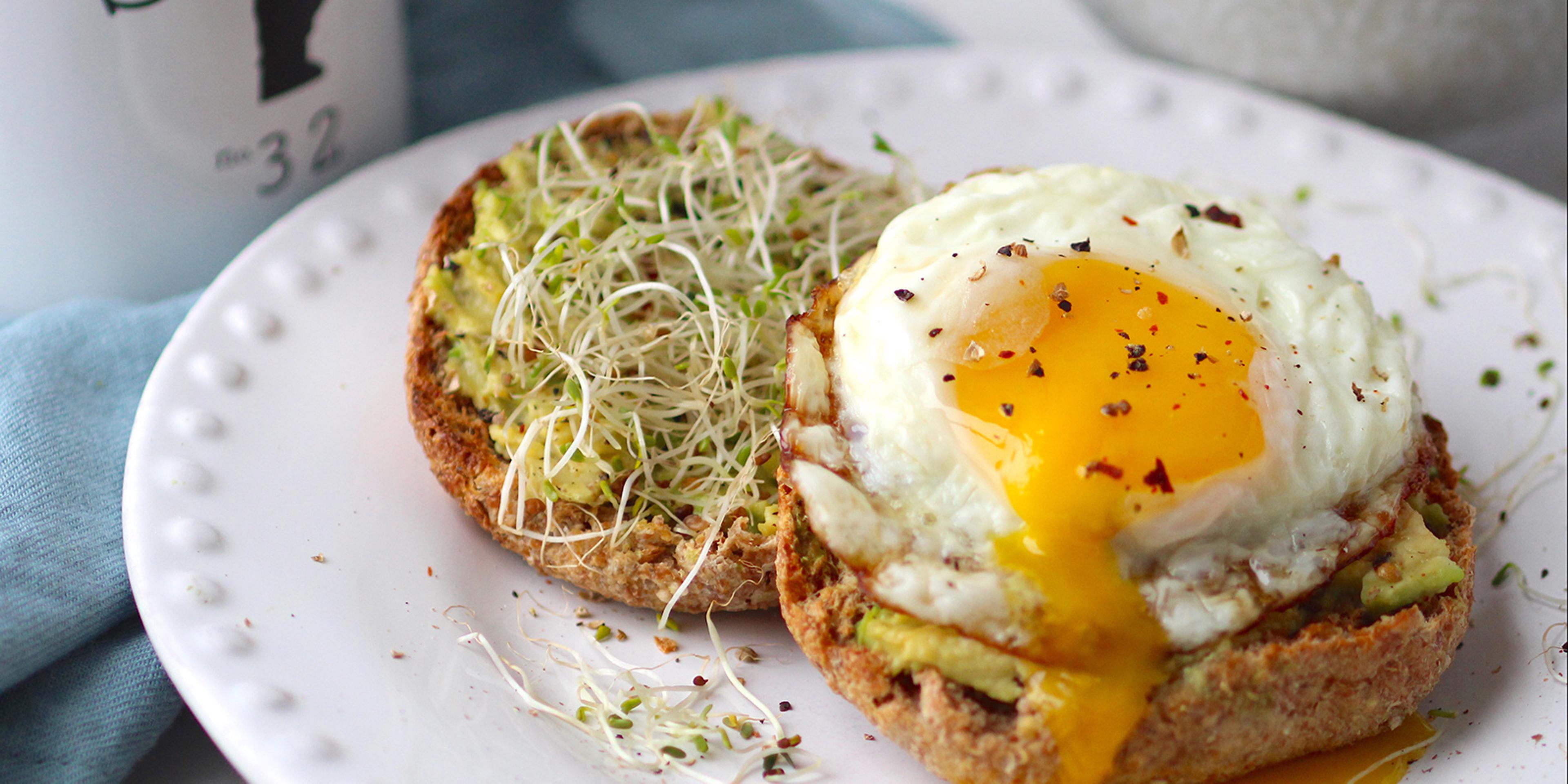 Avocado egg toast with a runny yolk.