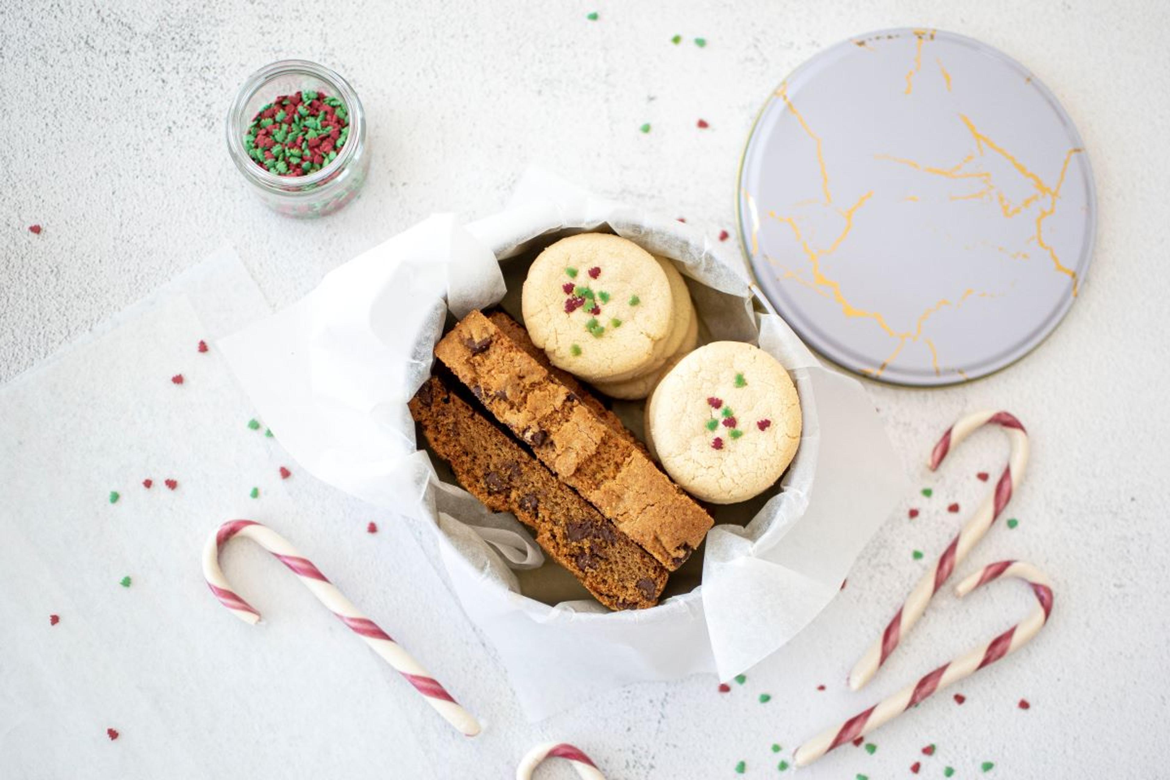 There are a number of holiday tins available to ship cookies in.