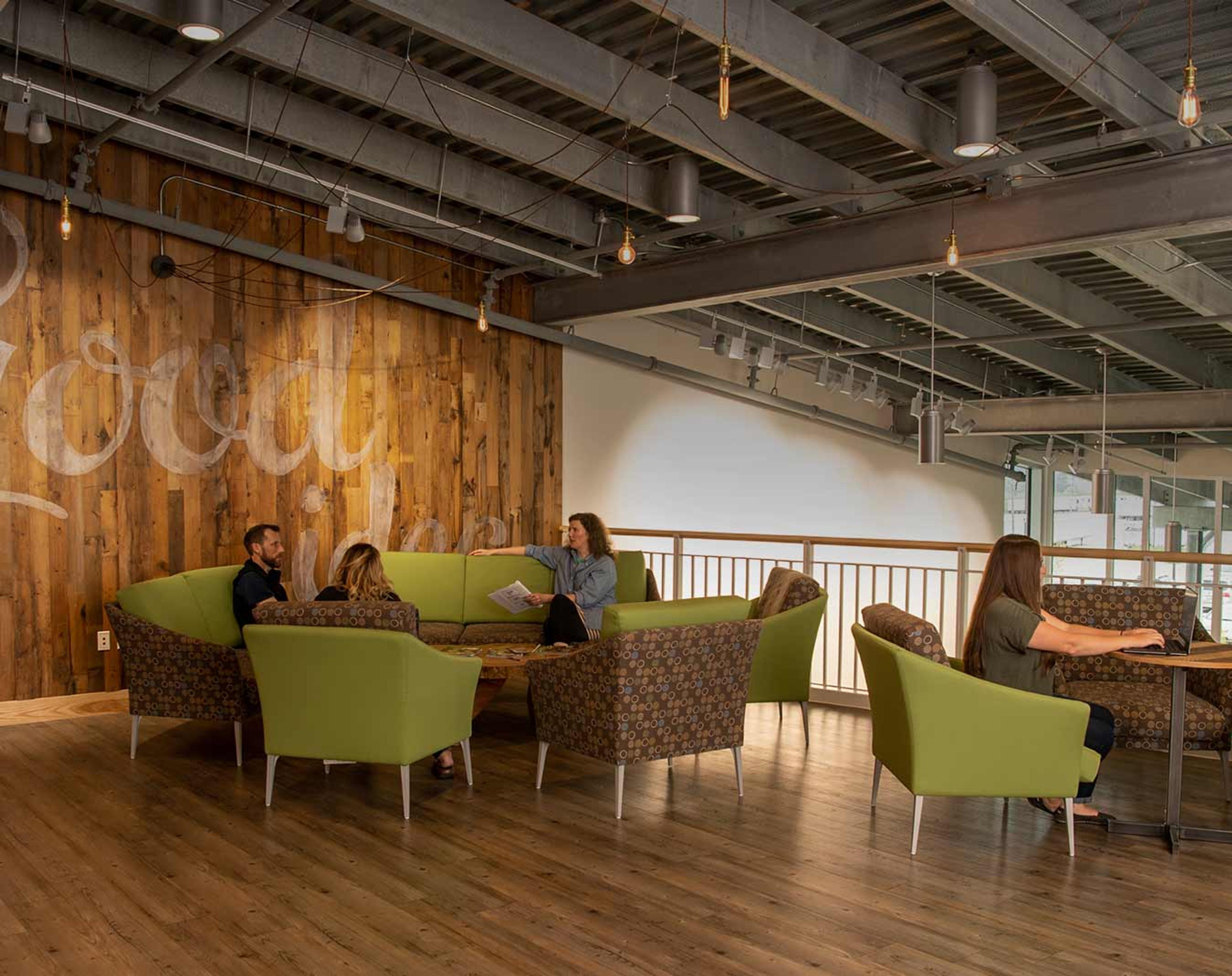 A group of employees gathered in a common area.