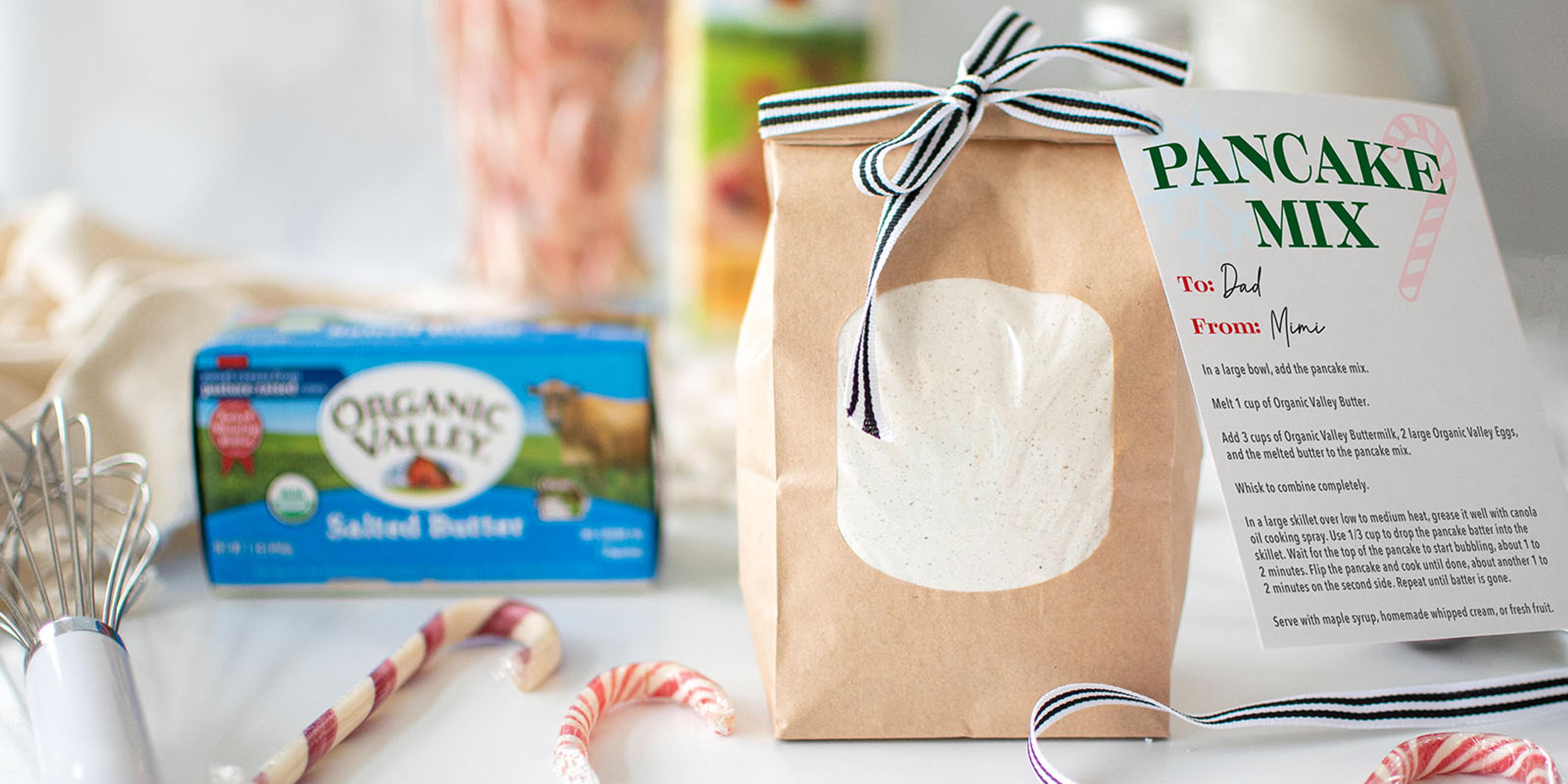 A bag of pancake mix with candy canes next to it.