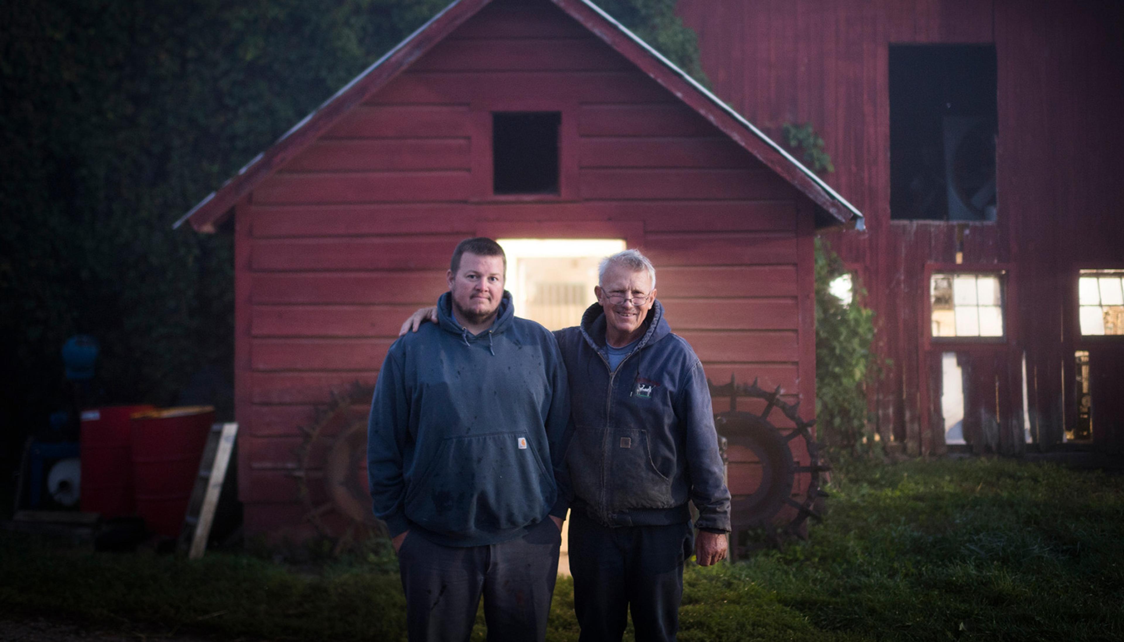 William and Dennis Baese, Organic Valley dairy farmers from Michigan, in front of their milking parlor.