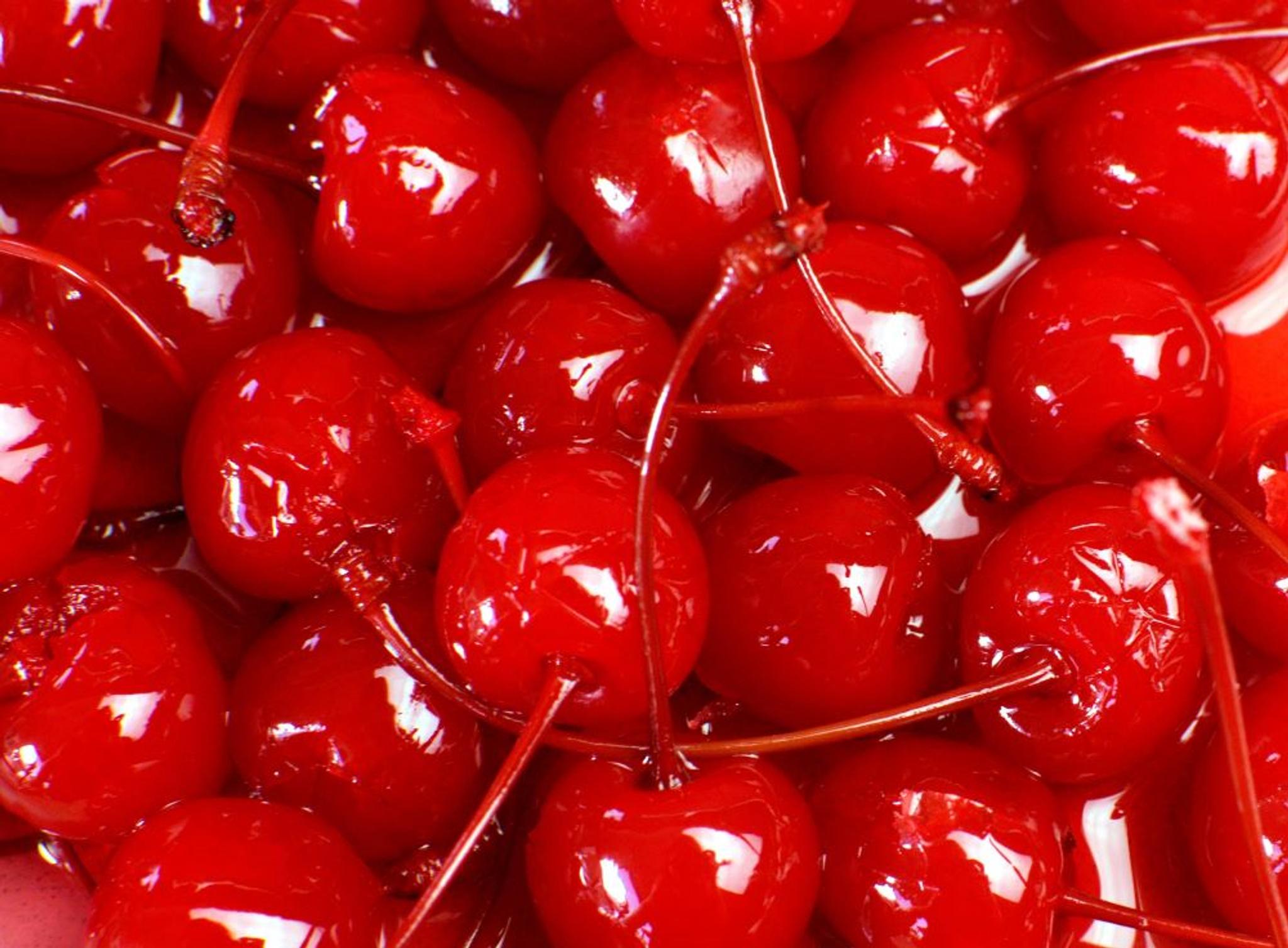 A close-up image of maraschino cherries.