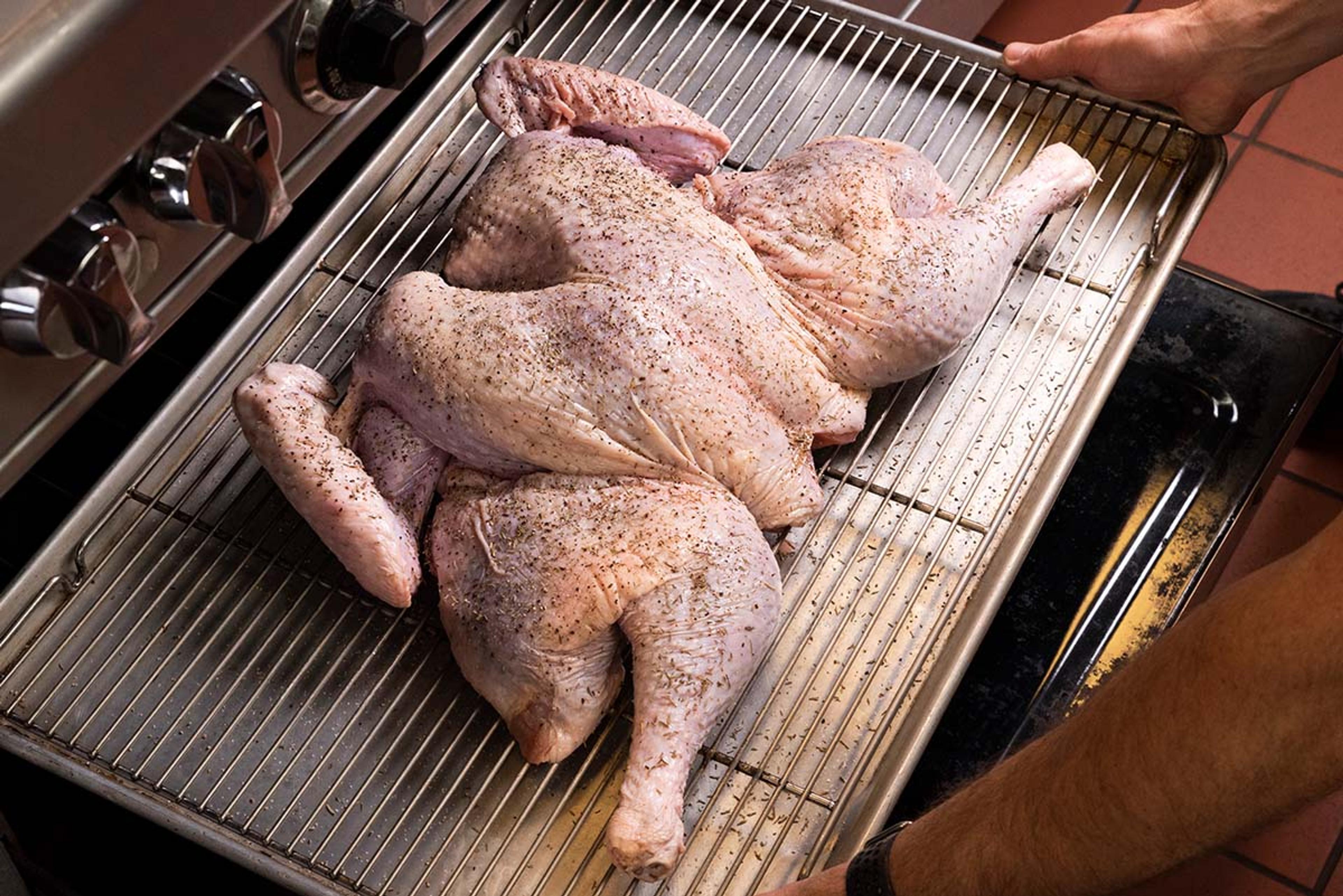 Put the turkey on a wire rack that is placed on a baking sheet.
