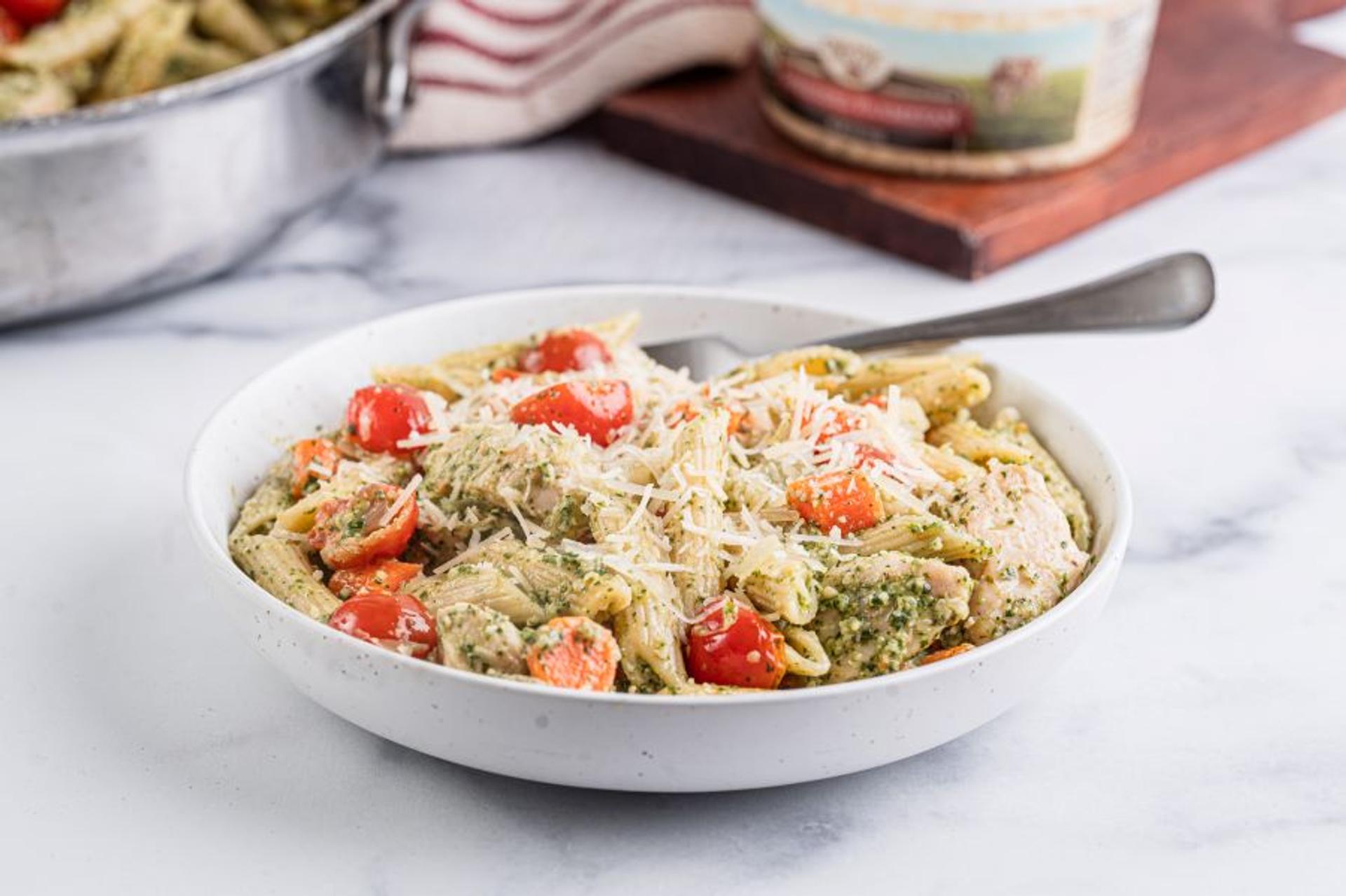 Carrot top pesto pasta in a bowl.