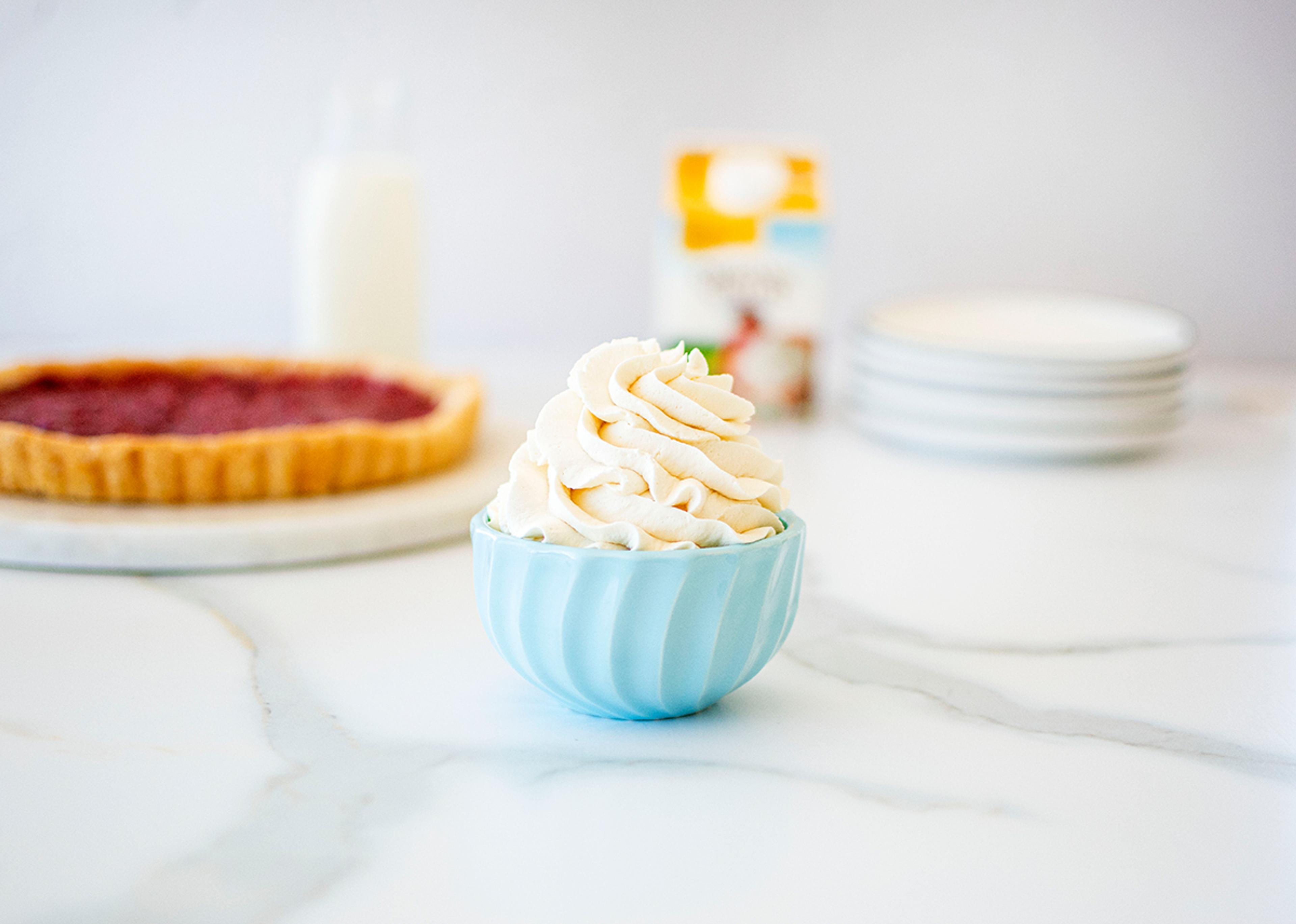 Homemade whipped cream piped in a bowl and ready to eat!