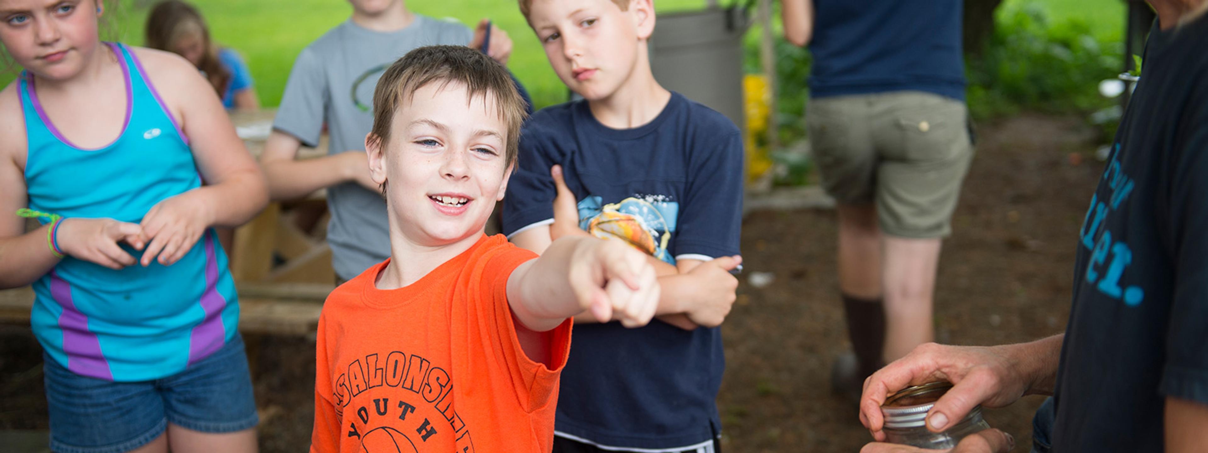 Kids participating in hands-on farm-day education