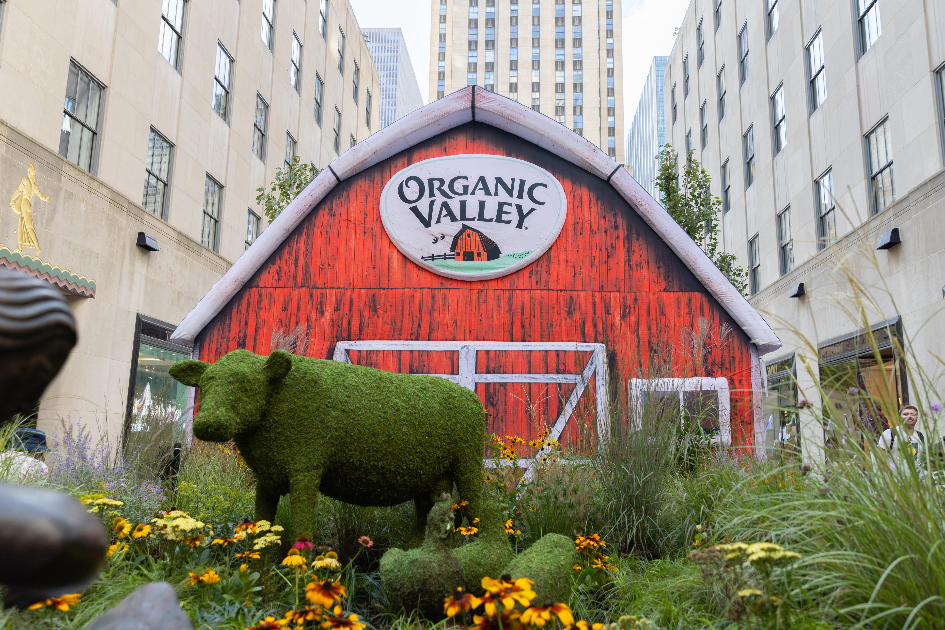 A makeshift barn and animal topiaries are shown in front of 30 Rockefeller Center.