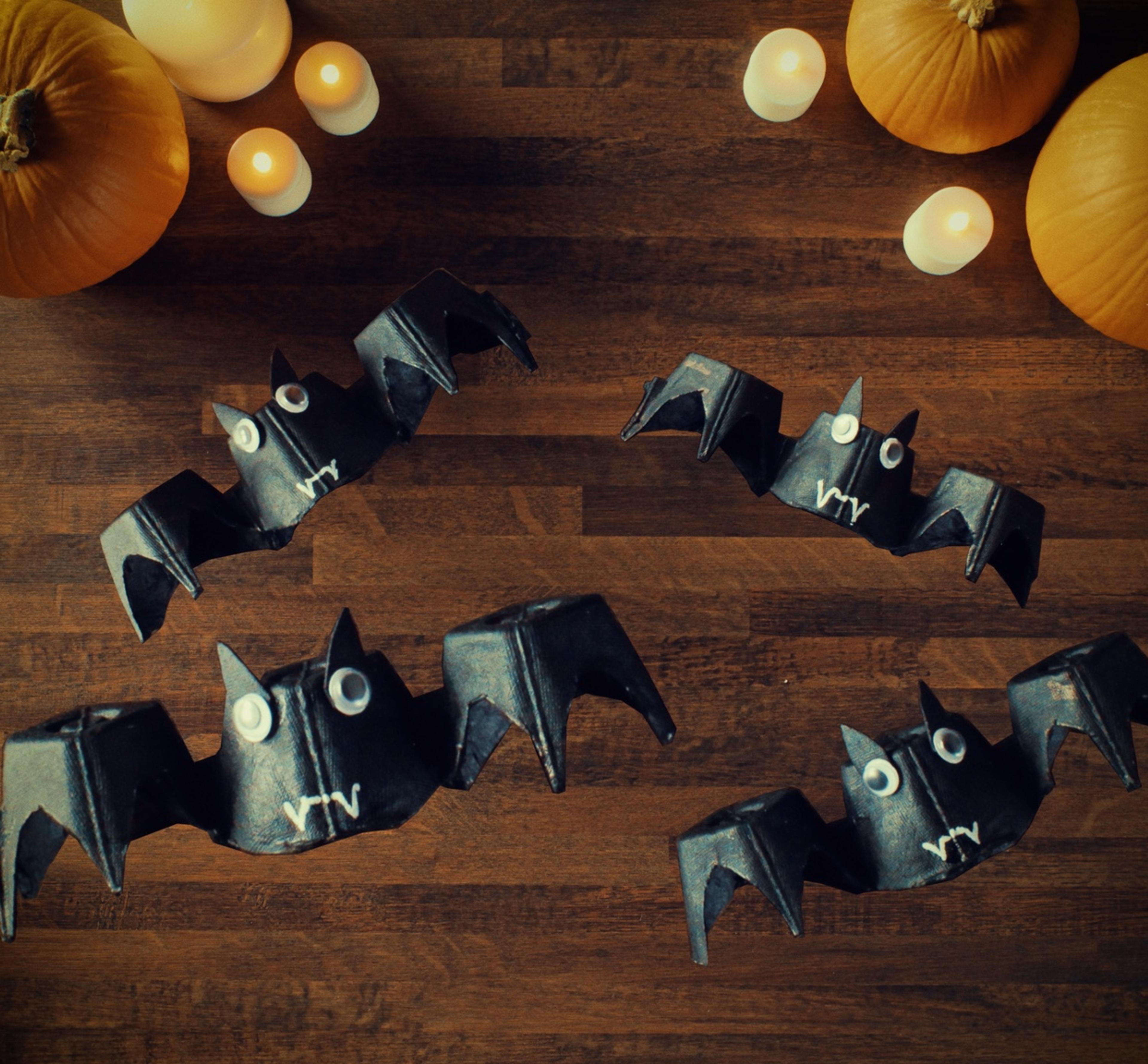 Four fully assembled egg carton bats.