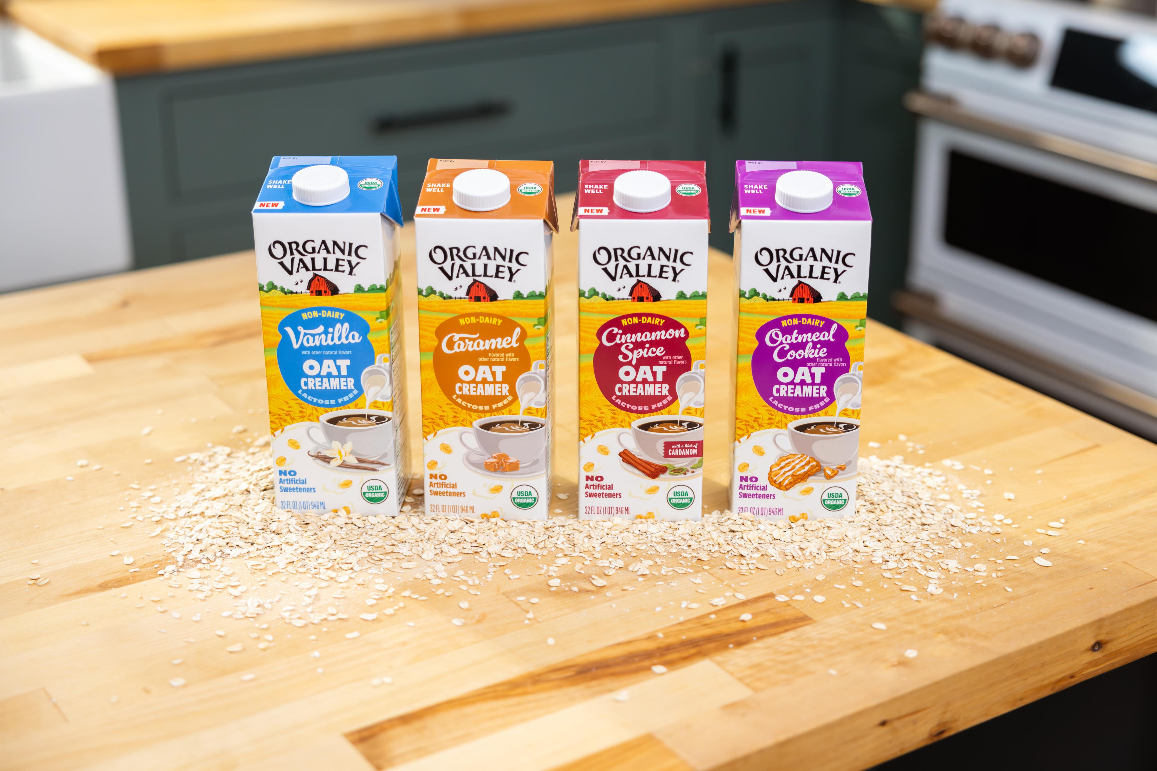 Cartons of organic oat creamers on a counter