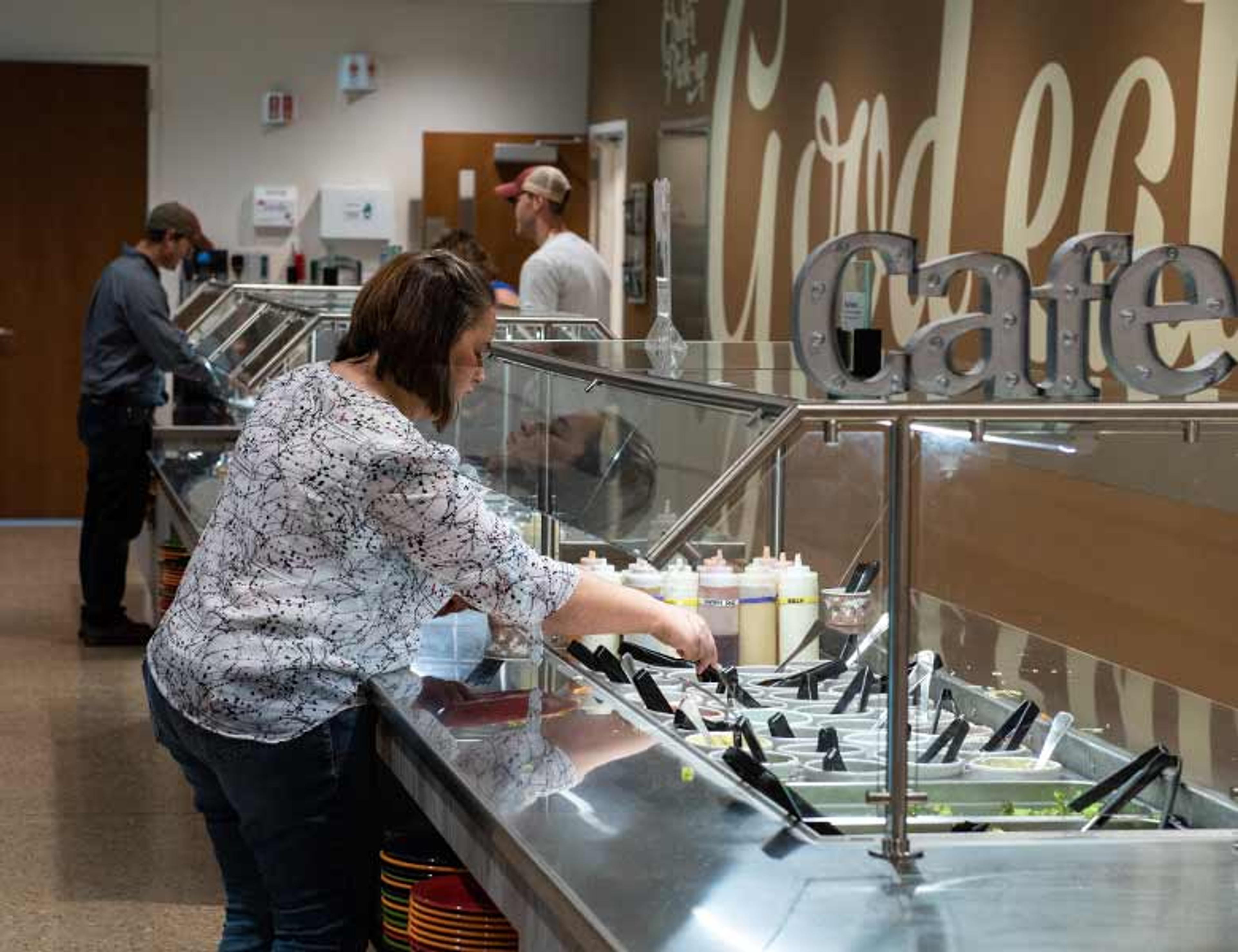 Employees getting lunch in Organic Valley's cafeteria.