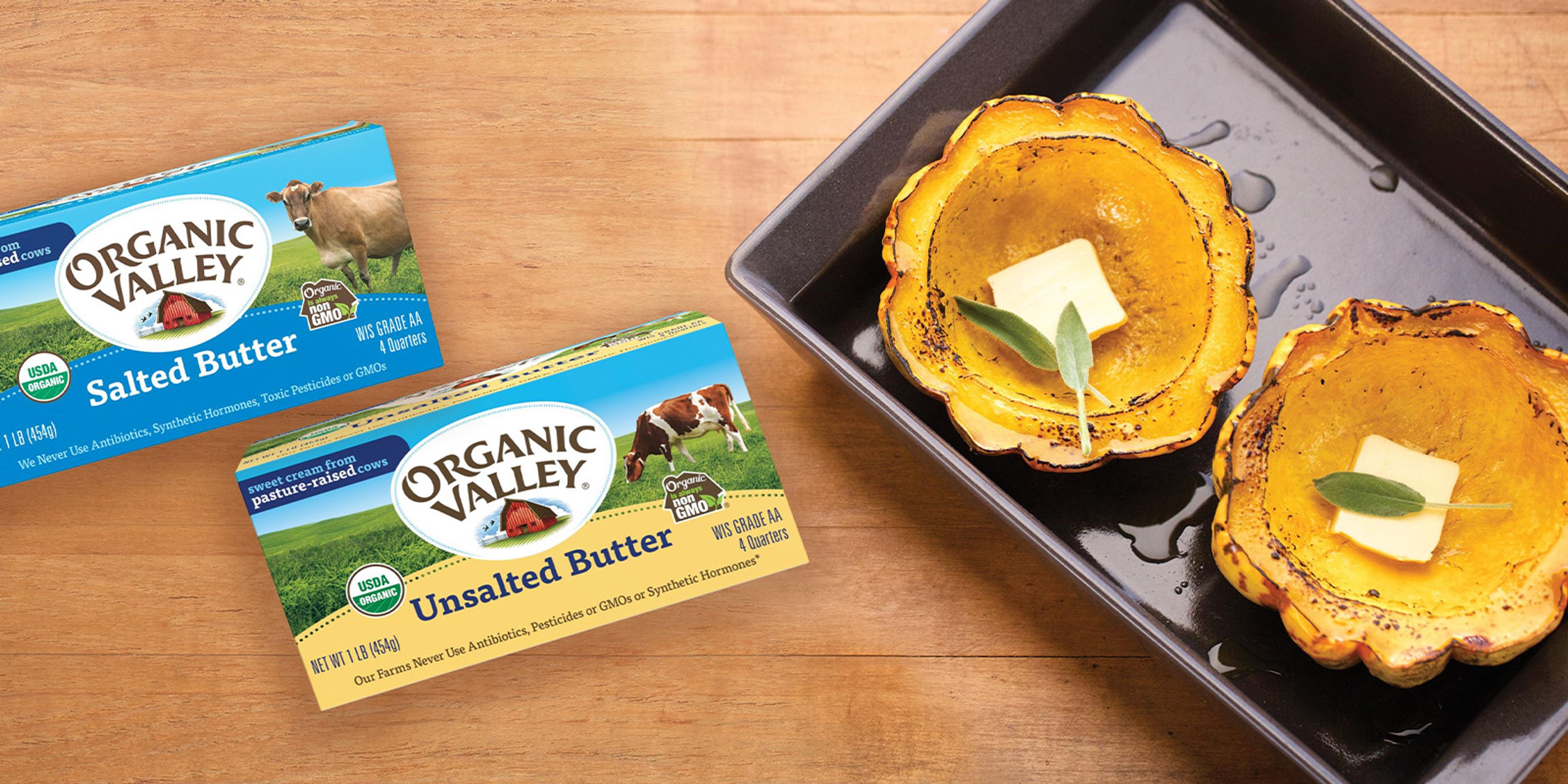 Two pounds of butter next to a pan with buttered squash.