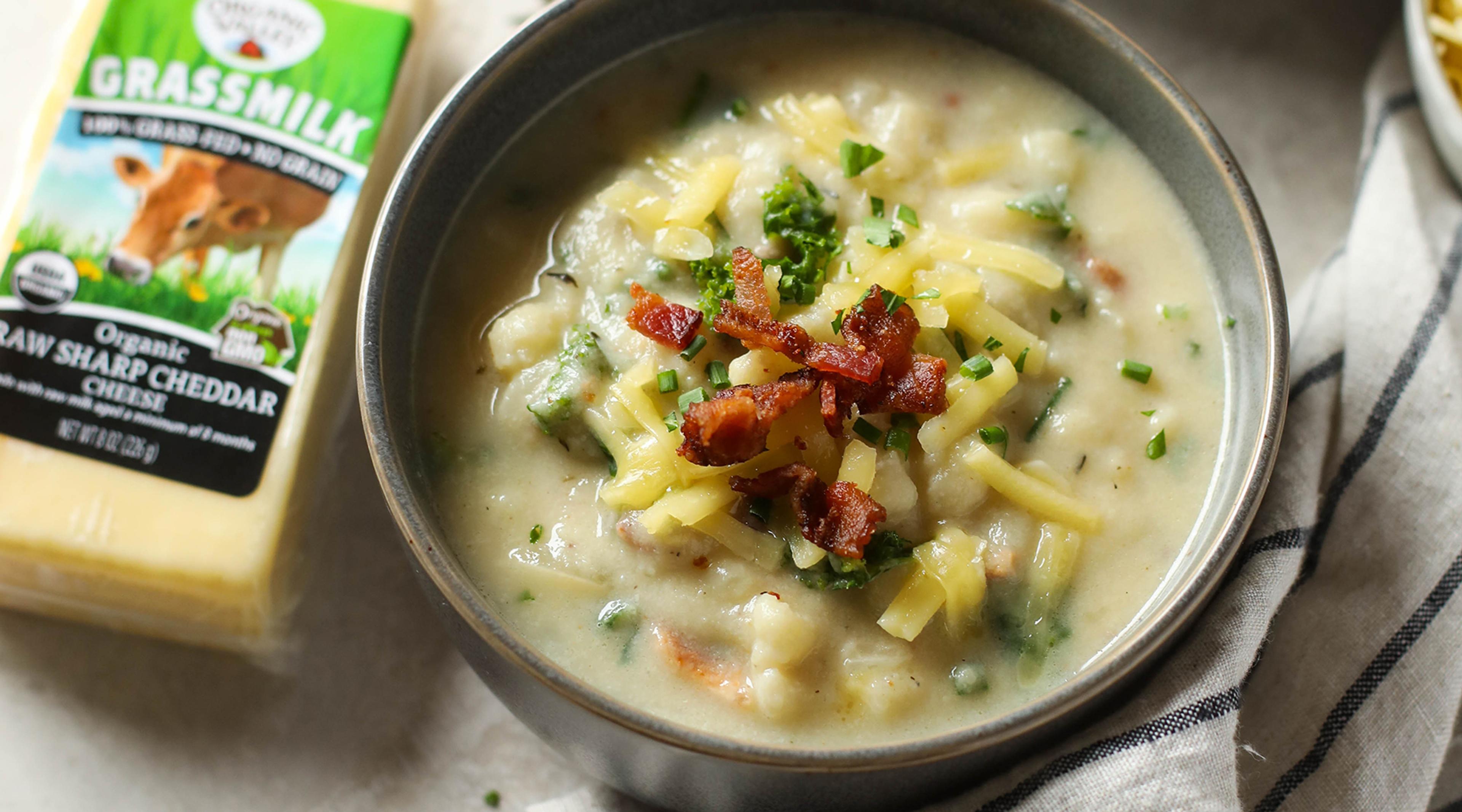A bowl of Loaded Cheesy Cauliflower Soup using Organic Valley’s Grassmilk Cheddar, topped with bacon crumbles. Image credit: the Real Food Dietitians.