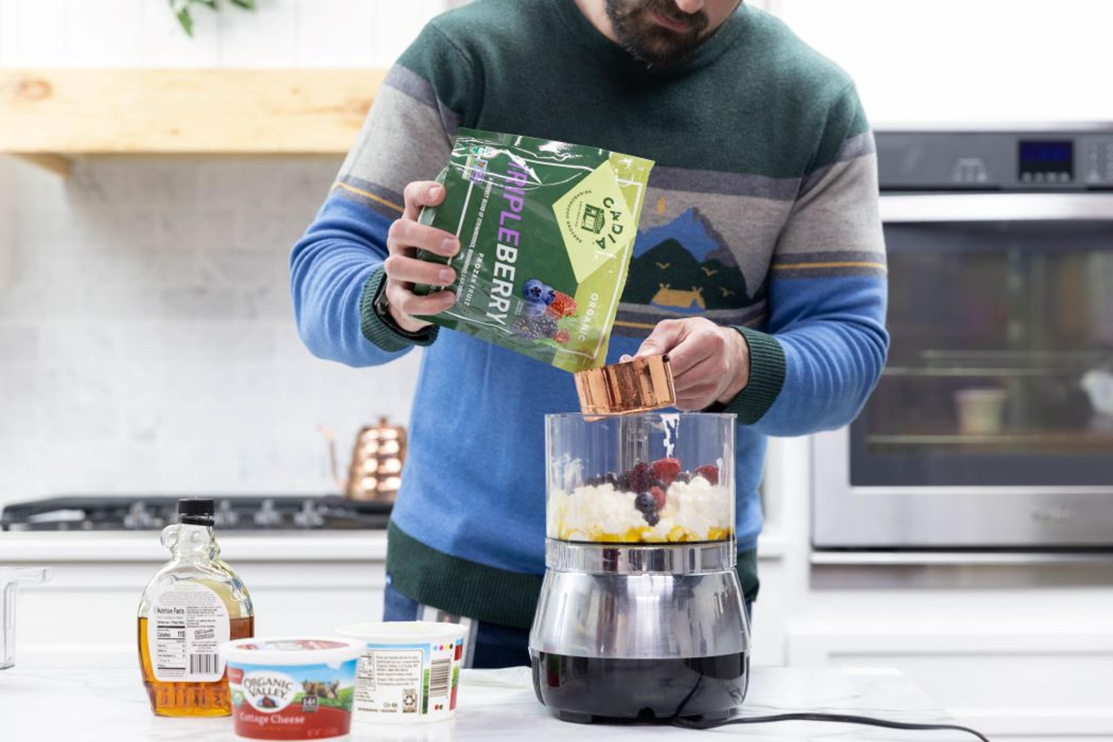 Organic Valley’s Devin Thorson puts cottage cheese, berries and maple syrup in a blender.
